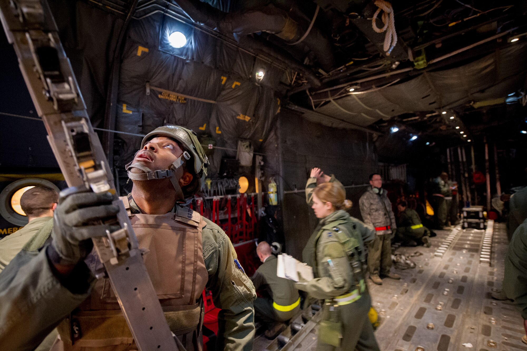 U.S. Air Force Staff Sgt. Ross Rudolph, 18th Aeromedical Evacuation Squadron medical technician, Kadena Air Base, Japan, configures a C-130 Hercules aircraft to receive simulated patients in Alexandria, La., Feb. 21, 2013, in support of Joint Readiness Training Center (JRTC) aeromedical evacuation training. Service members at JRTC 13-04 are educated in combat patient care and aeromedical evacuation in a simulated combat environment. (U.S. Air Force photo by Tech. Sgt. John R. Nimmo, Sr./RELEASED) DIGITAL