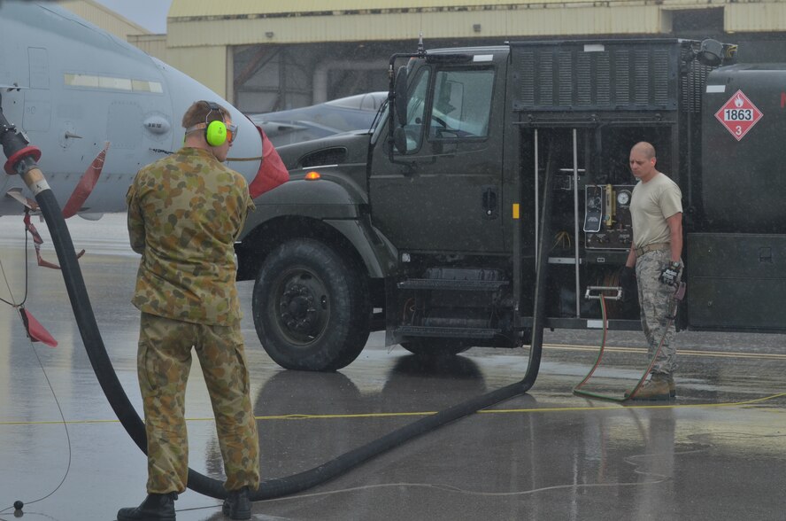 U.S Air Force 36 TH Logistics Readiness Squadron fuels flight services Royal Australian Air Force F/A-18 Hornet after landing on the Andersen Air Force Base, Guam flight line during Cope North 2013 Feb 12. 2013. Cope North is an annual air combat tactics, humanitarian assistance and disaster relief exercise designed to increase the readiness and interoperability of the U.S. Air Force, Japan Air Self-Defense Force and Royal Australian Air Force. (U.S. Air Force photo by Staff Sgt. Alex Montes/RELEASED)

