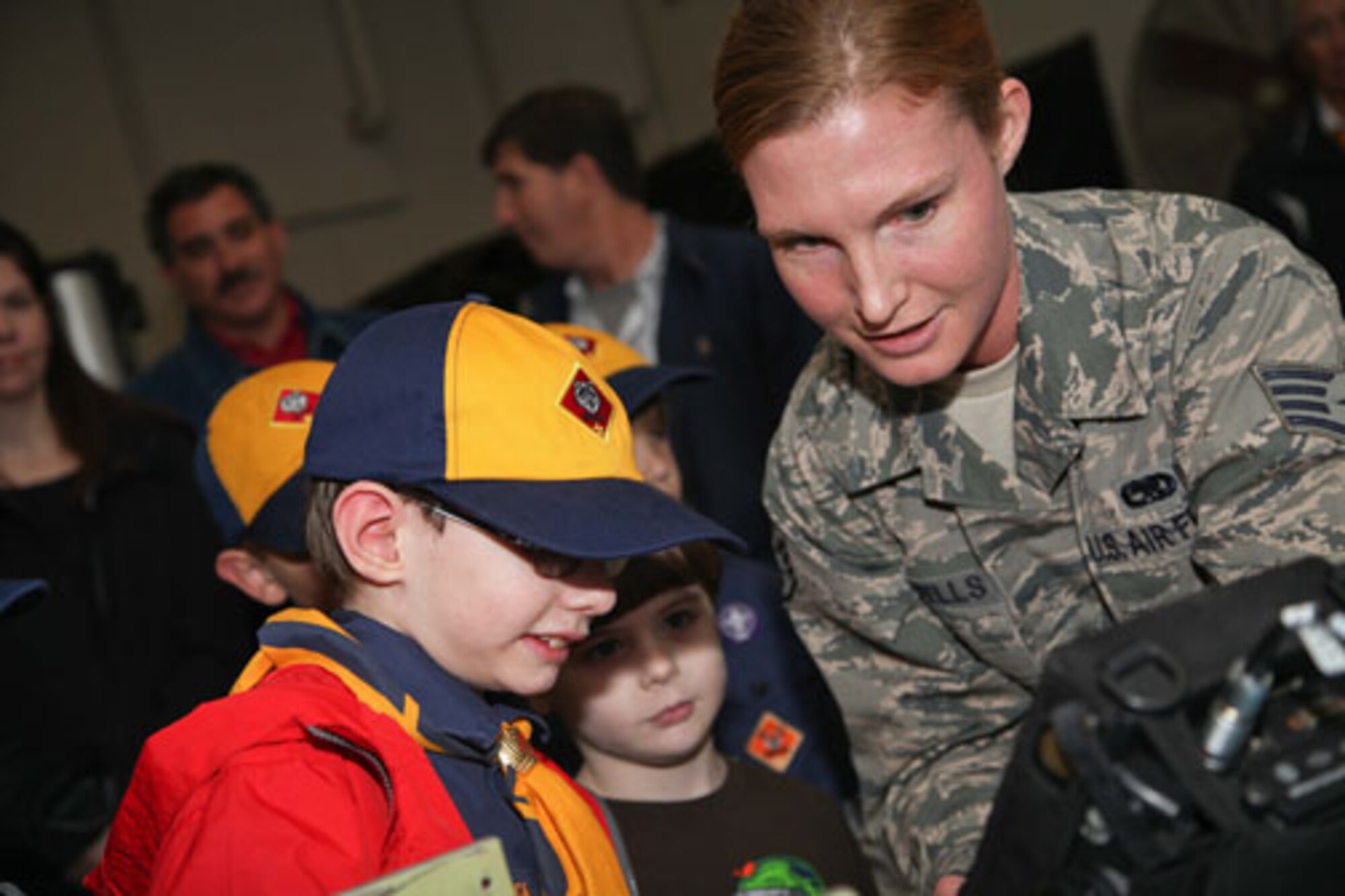 Charleston-based Cub Scouts from Den 5 take a tour of Joint Base Charleston with members of the 315th Airlift Wing Saturday, Feb. 23, 2013.  The Cub Scouts, ranging in age from eight to 11, were met by 315 AW Commander, Col. James J. Fontanella who gave a briefing and video presentation at the start of their tour.  Their visit concluded with a trip to the 315th Maintenance Group's fabrication shop, and followed with the cubs and their parents climbing aboard a C-17 Globemaster III aircraft to see it up close. (U.S. Air Force photo/Staff Sgt. Rashard Coaxum)