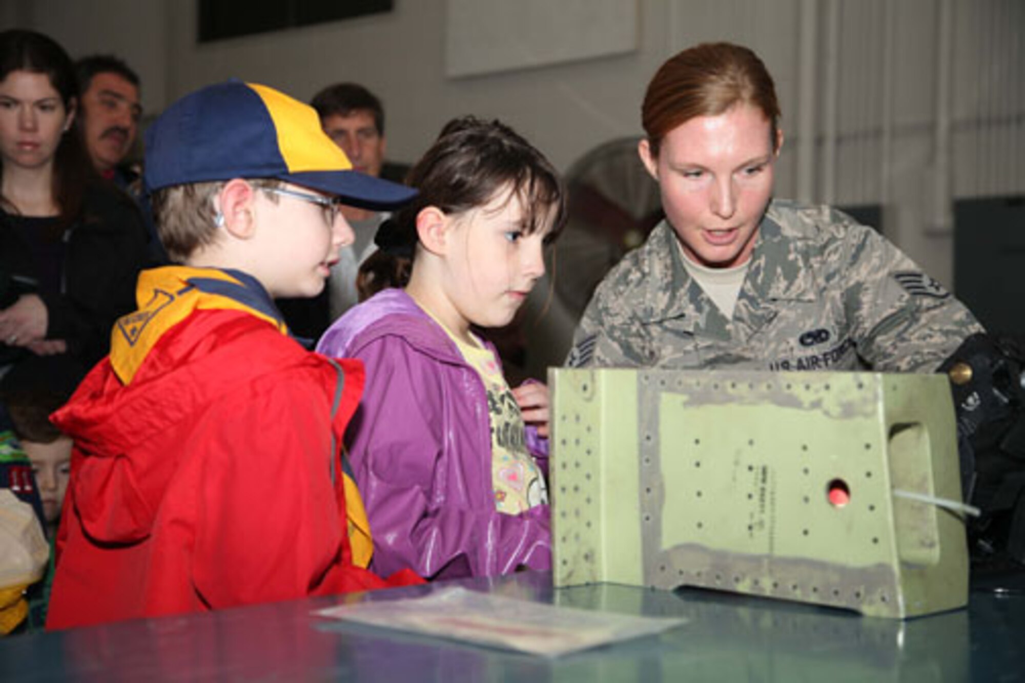 Charleston-based Cub Scouts from Den 5 take a tour of Joint Base Charleston with members of the 315th Airlift Wing Saturday, Feb. 23, 2013.  The Cub Scouts, ranging in age from eight to 11, were met by 315 AW Commander, Col. James J. Fontanella who gave a briefing and video presentation at the start of their tour.  Their visit concluded with a trip to the 315th Maintenance Group's fabrication shop, and followed with the cubs and their parents climbing aboard a C-17 Globemaster III aircraft to see it up close. (U.S. Air Force photo/Staff Sgt. Rashard Coaxum)