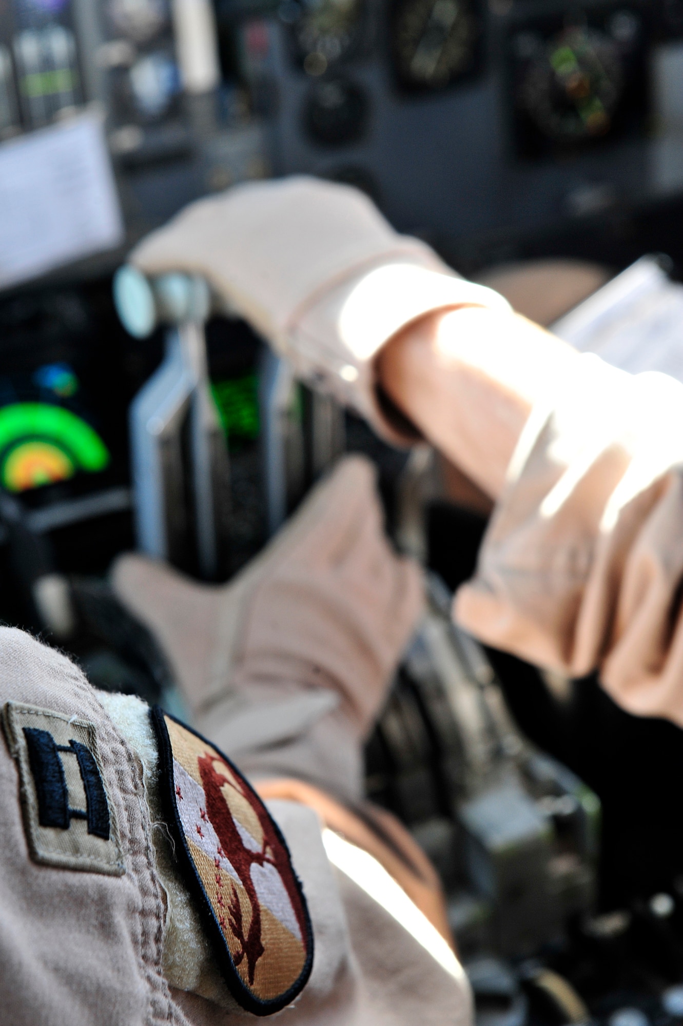 U.S. Air Force Capt. Josh Izakson, 963rd Expeditionary Airborne Air Control Squadron E-3 Sentry pilot, and Capt. Terrance Allen, 963 EAACS  E-3 Sentry co-pilot, accomplish a combat support mission over an undisclosed location in Southwest Asia Feb. 12, 2013. The E-3 Sentry is an airborne warning and control system (AWACS) aircraft that provides all-weather surveillance, command, control and communications needed by U.S. and NATO decision-makers. Izakson and Allen are deployed from the 962nd Airborne Air Control Squadron, Elmendorf Air Force Base, Alaska. (U.S. Air Force photo by Tech. Sgt. Christina M. Styer/Released)