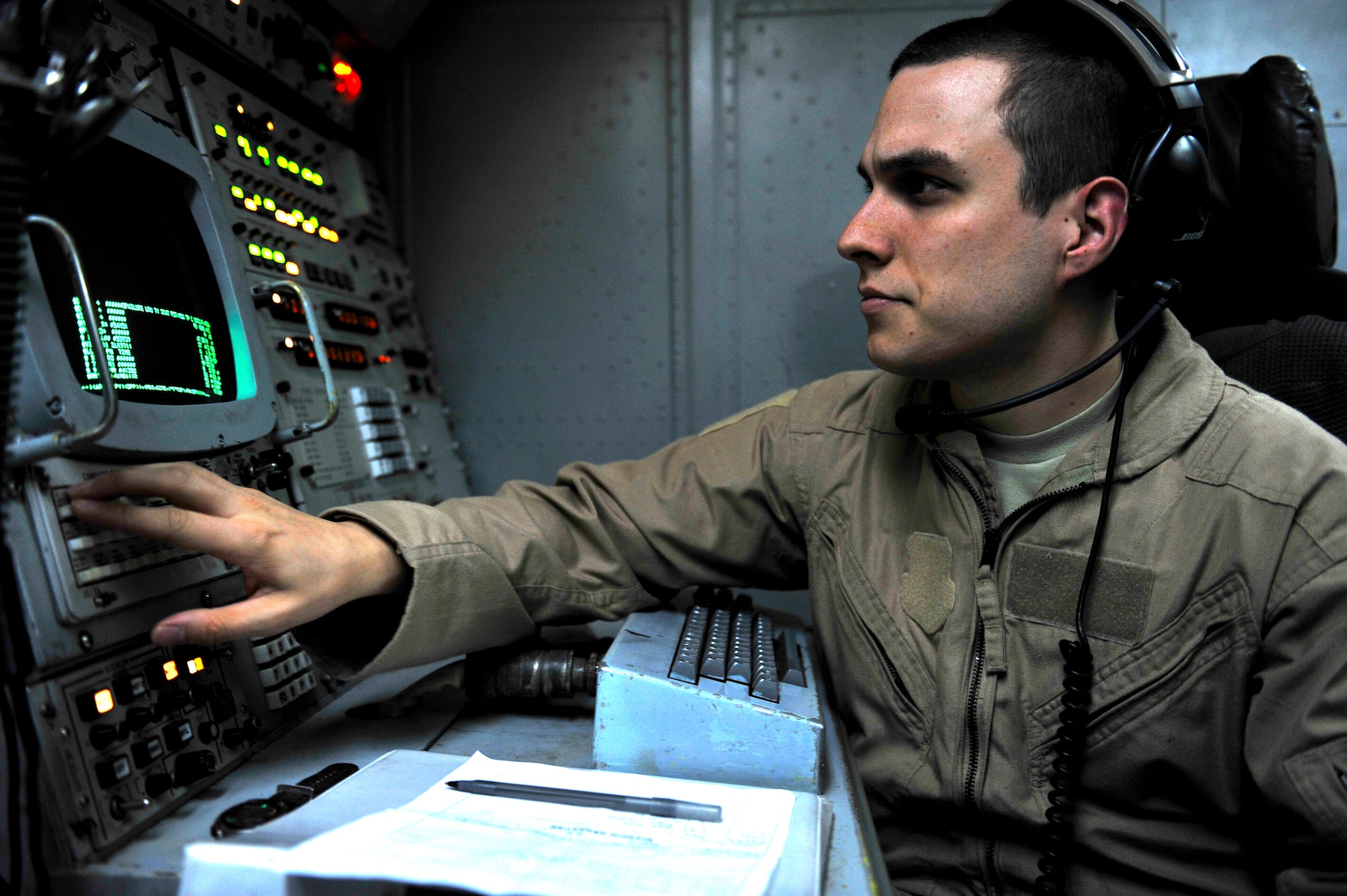 U.S. Air Force Staff Sgt.Joseph Chignola, 963rd Expeditionary Airborne Air Control Squadron computer display maintenance technician, accomplishes a combat support mission aboard an E-3 Sentry over an undisclosed location in Southwest Asia Feb. 12, 2013. The E-3 Sentry is an airborne warning and control system (AWACS) aircraft that provides all-weather surveillance, command, control and communications needed by U.S. and NATO decision-makers. Chignola is deployed from the 962nd Airborne Air Control Squadron, Elmendorf Air Force Base, Alaska. (U.S. Air Force photo by Tech. Sgt. Christina M. Styer/Released)