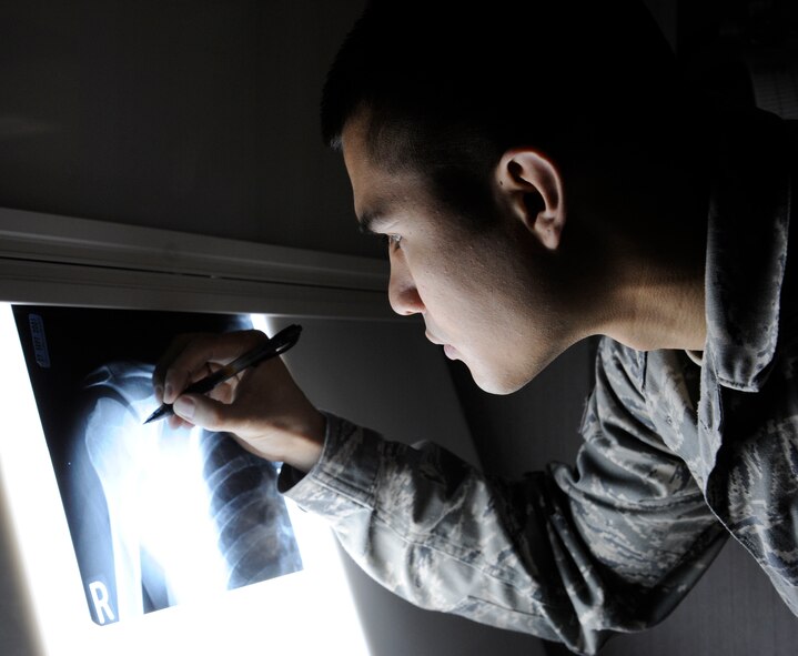 Senior Airman James Lord, 2nd Medical Group radiology technician, looks at an X-ray image at the radiology laboratory on Barksdale Air Force Base, La., Feb. 25. Radiology Airmen help quality check images taken to ensure the correct area of a patient's body has been X-rayed. (U.S. Air Force photo/Airman 1st Class Andrew Moua)