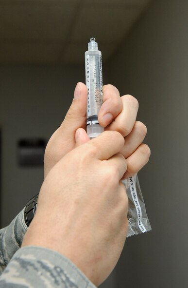 Senior Airman James Lord, 2nd Medical Group radiology technician, prepares a syringe at the radiology laboratory on Barksdale Air Force Base, La., Feb. 25. Radiology Airmen capture X-ray images and Computed Tomography scans and provide them to radiologists to diagnose patients and refer them for appropriate treatment. (U.S. Air Force photo/Airman 1st Class Andrew Moua)