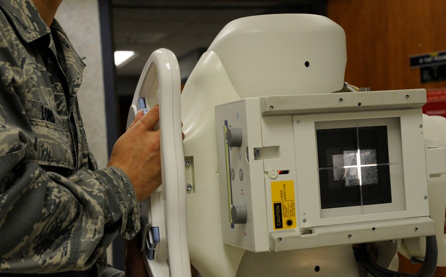 Senior Airman James Lord, 2nd Medical Group radiology technician, prepares an X-ray machine at the radiology laboratory on Barksdale Air Force Base, La., Feb. 25. Radiology Airmen use many types of equipment and techniques to assist the radiologists with patient diagnosis, such as an adjustable X-ray machine to scan different sections of the human body. (U.S. Air Force photo/Airman 1st Class Andrew Moua)