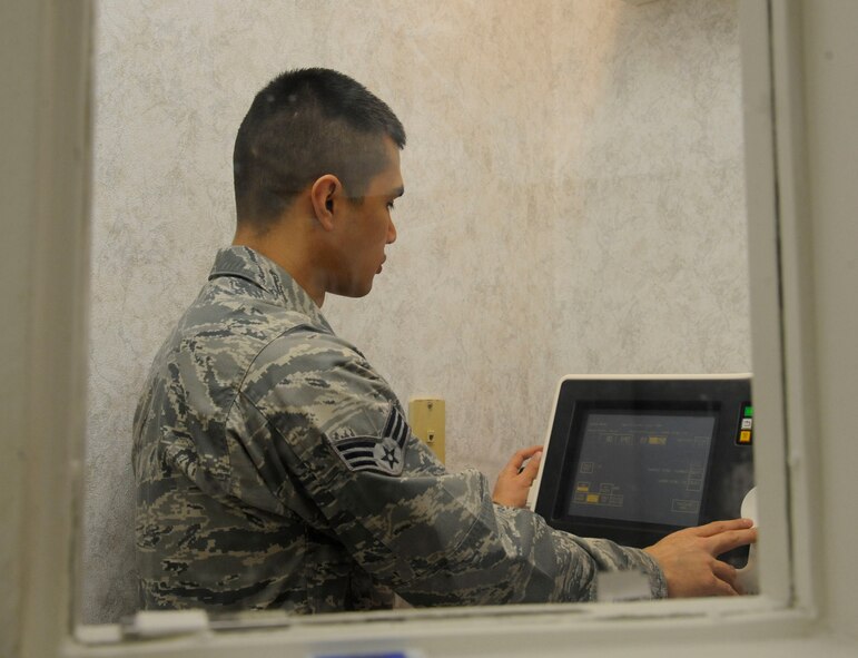 Senior Airman James Lord, 2nd Medical Group radiology technician, adjusts the settings of an X-ray machine at the radiology laboratory on Barksdale Air Force Base, La., Feb. 25. Radiology Airmen capture X-ray images and Computed Tomography scans and provide them to radiologists who diagnose patients and refer them for treatment. (U.S. Air Force photo/Airman 1st Class Andrew Moua)