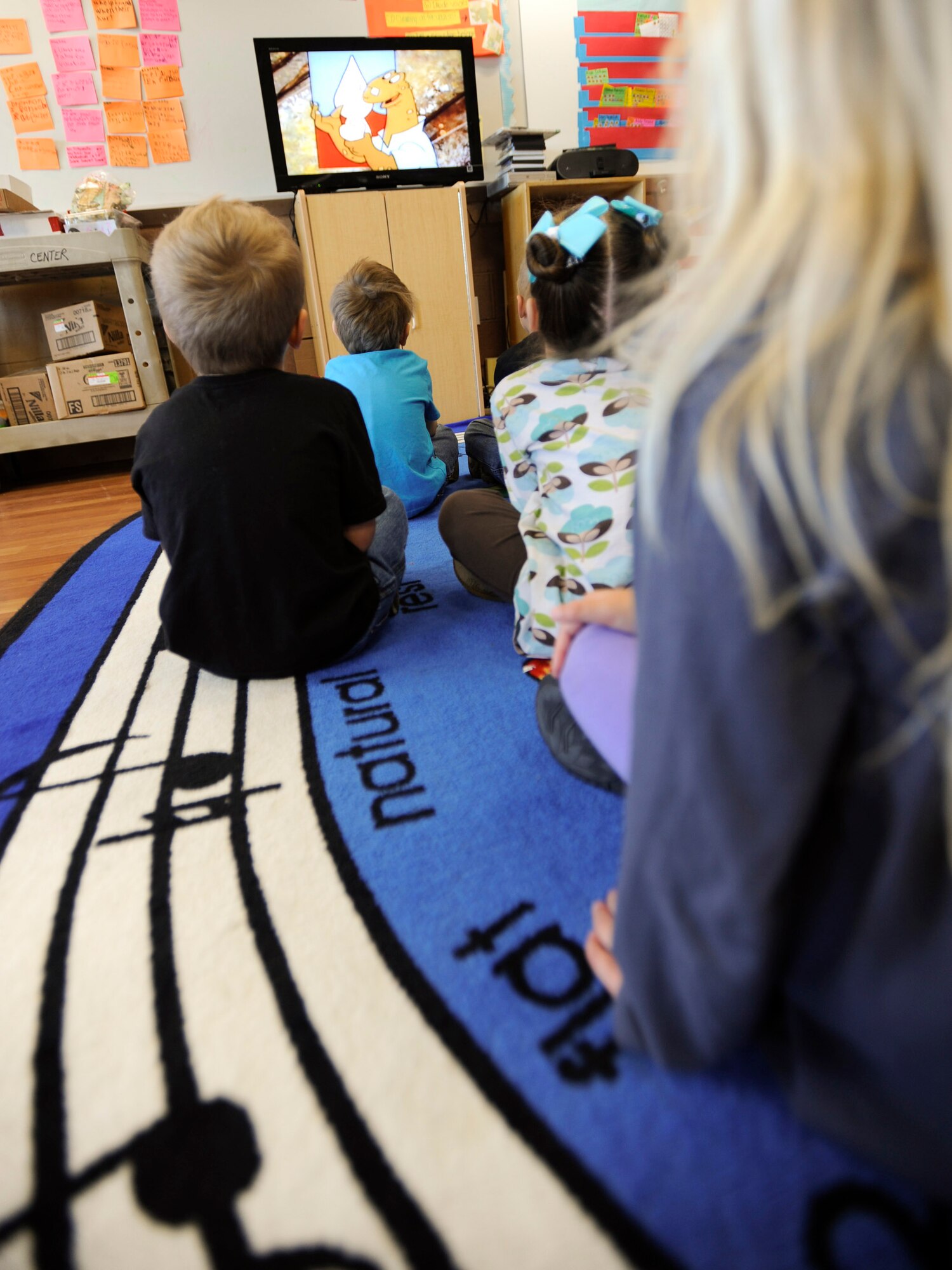 VANDENBERG AIR FORCE BASE, Calif. –Students from the Vandenberg Youth Center watch a dental cartoon here at the Youth Center Friday, Feb. 22, 2013. In 1981 the Children’s Dental Health Day was extended to a month-long celebration known as National Children’s Dental Health Month. (U.S. Air Force photo/Airman Yvonne Morales)