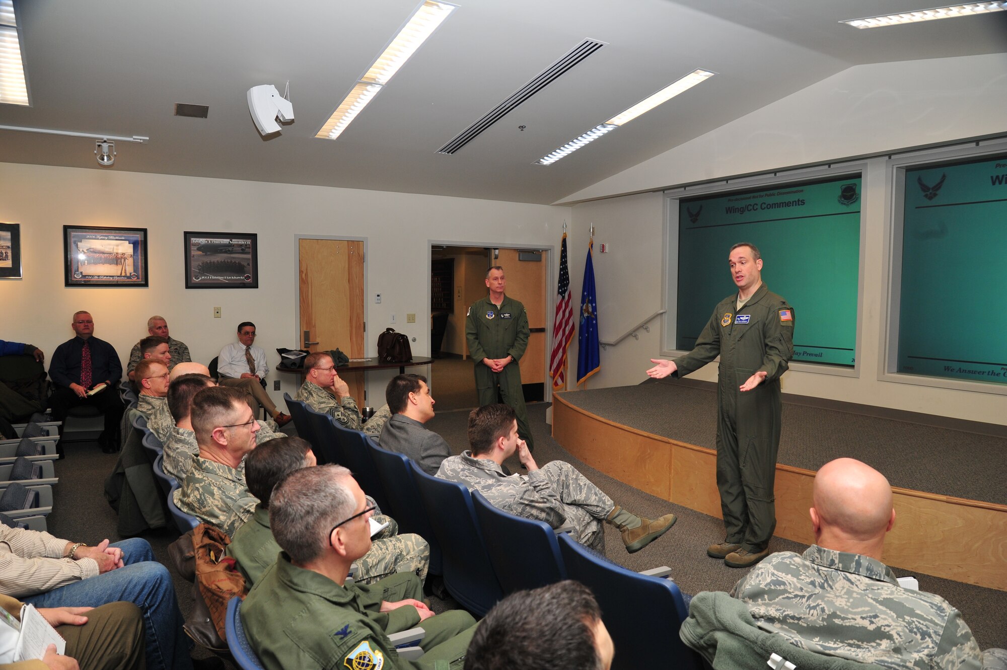 Col. Brian Newberry, 92nd Air Refueling Wing commander, and Col. Daniel Swain, 141st Air Refueling Wing commander, provides closing comments during an out- brief for the KC-46A site survey team at Fairchild Air Force Base, Wash., Feb. 23, 2013. The team presented data collected during their inspection. The team visited Fairchild to inspect areas of the base to create an unbiased report to determine which of four bases would be selected to fly the new KC-46A refueling tanker. (U.S. Air Force photo by Senior Airman Taylor Curry) 