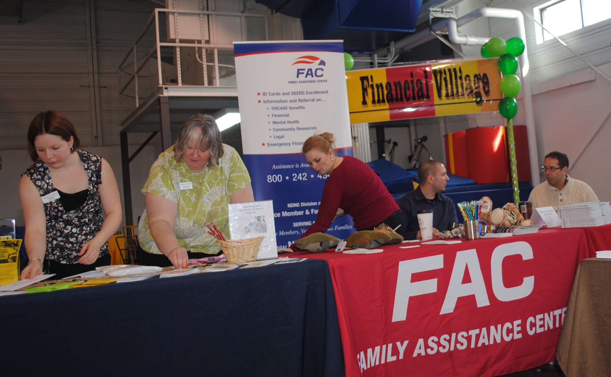 Representatives from on- and off-base organizations set up their booths during the 2013 Financial Information Fair, one of two events hosted by the Airman & Family Readiness Center, which helped kick off this year’s Military Saves Week campaign on Feb. 21, 2013, on Grand Forks Air Force Base, N.D. (U.S. Air Force photo/Senior Airman Luis Loza Gutierrez)