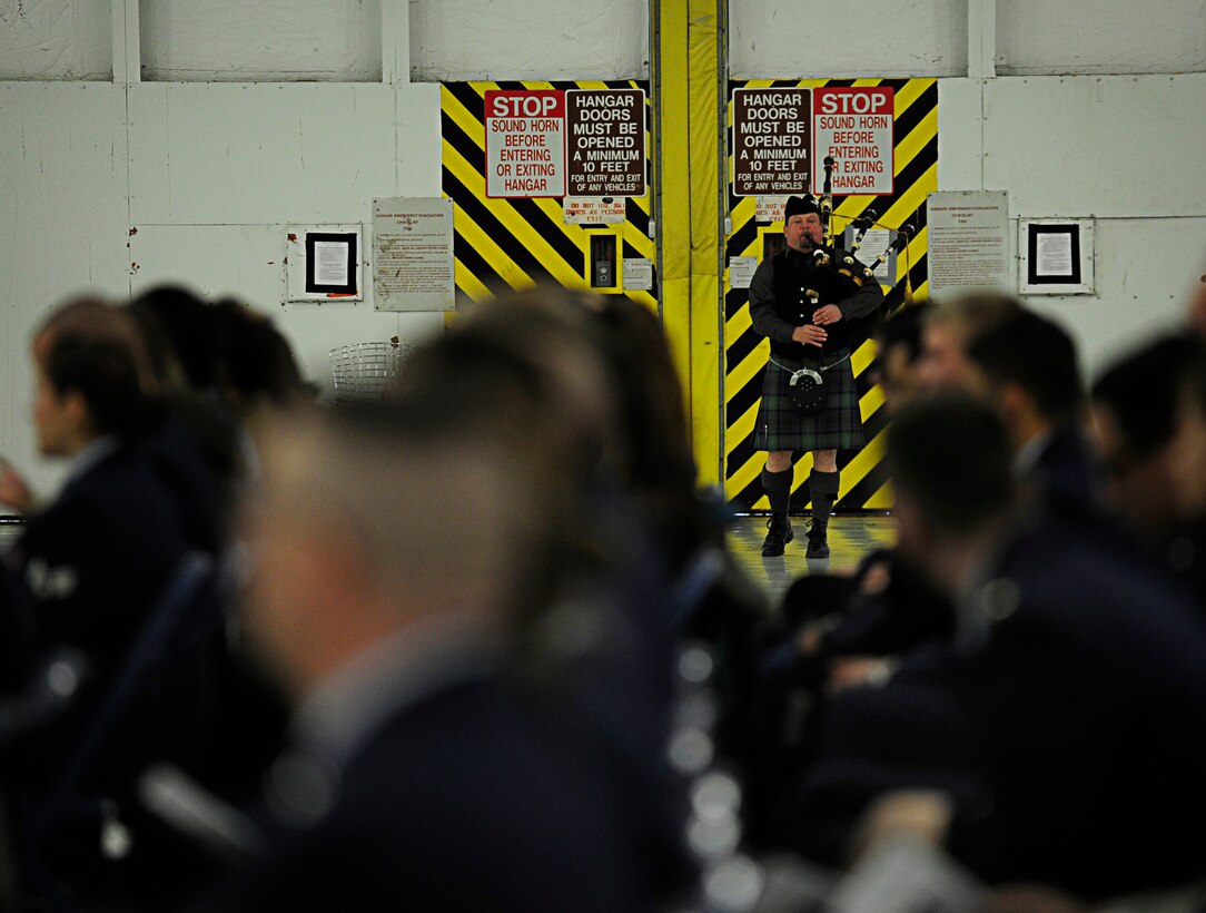 A bagpiper plays “Amazing Grace” during a memorial service in honor of the late Senior Airman John E. King II, 89th Aerial Port Squadron, Joint Base Andrews, Md., Feb. 22, 2013. King passed away while on duty Feb. 17, leaving behind his wife, Airman 1st Class Natalee King, and his son, John James King III. During the ceremony, Airmen spoke about the life he lived and the impact he had on each of them. (U.S. Air Force photo/Senior Airman Lauren Main)