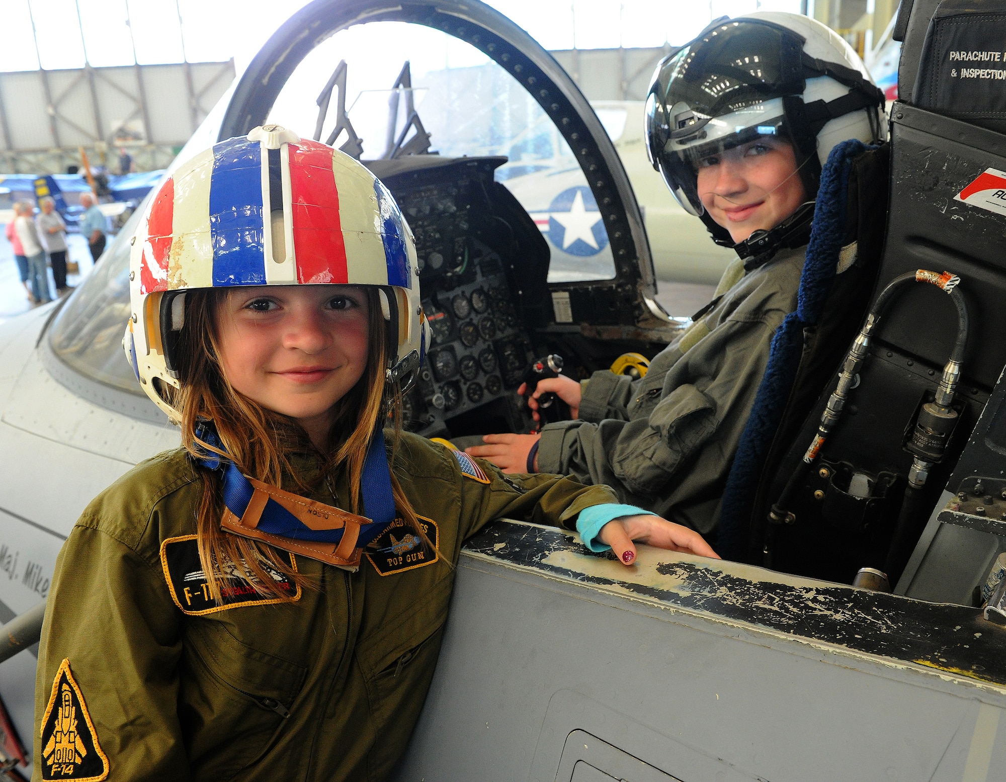 Carl Hess, Make-A-Wish recipient, and his sister Kayelynn Hess pose for a photo near an F-15 Fighting Eagle's cockpit at the Pacific Aviation Museum, Ford Island, Hawaii, Feb. 19, 2013. Carl is fighting acute lymphoblastic leukemia (ALL), a fast-growing cancer of the white blood cells, and his wish was to be a downed World War II pilot. Since 1980, the MAW Foundation has changed the lives of children with life-threatening medical conditions through its wish-granting work. (U.S. Air Force photo/Tech. Sgt Jerome S. Tayborn)