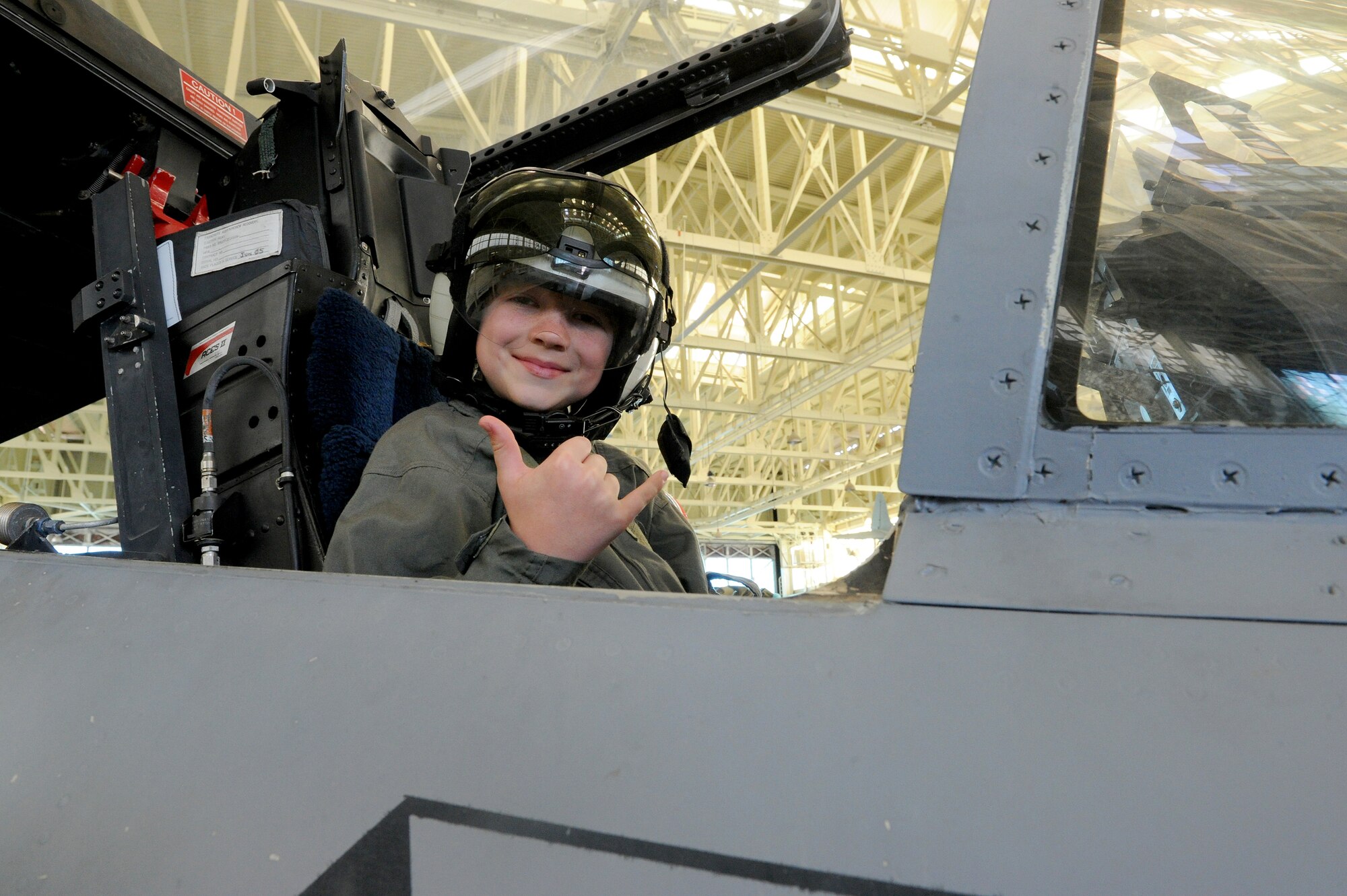 Carl Hess, Make-A-Wish recipient, sits inside an F-15 Fighting Eagle cockpit at the Pacific Aviation Museum, Ford Island, Hawaii, Feb. 19, 2013. Carl is fighting acute lymphoblastic leukemia (ALL), a fast-growing cancer of the white blood cells, and his wish was to be a downed World War II pilot. The MAW Foundation worked in partnership with various Hawaiian military agencies to fulfill Carl's wish and tour historical sites around Oahu. (U.S. Air Force photo/Tech. Sgt Jerome S. Tayborn)