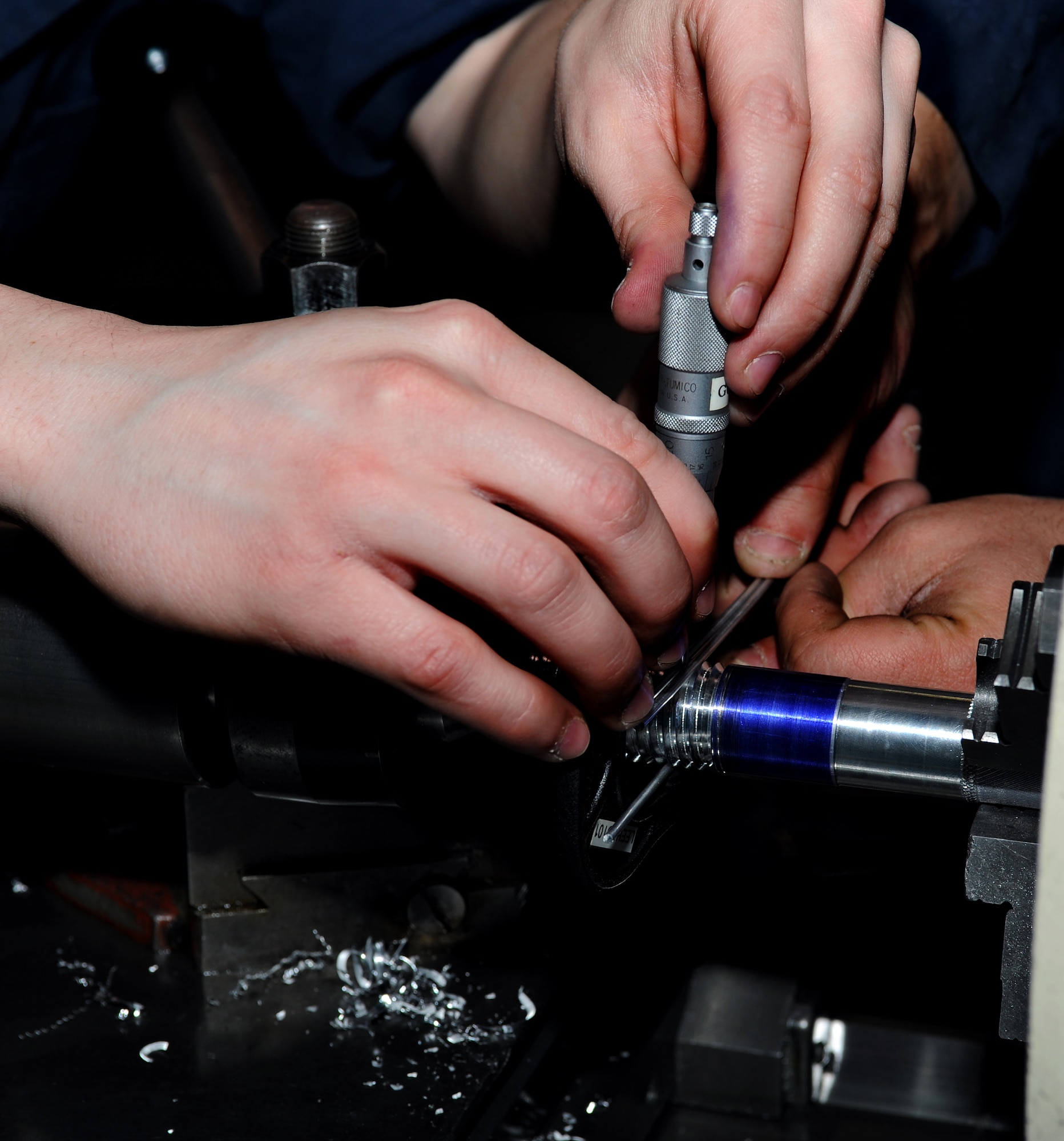 U.S. Air Force Airman 1st Class Spencer Chambers, 1st Maintenance Squadron Metals Technology aircraft metals technologist, double checks measurements of a screw at Langley Air Force Base, Va., Feb. 19, 2013. Metals technologists encompass highly developed mechanical skills with a little touch of artistic capabilities.  (U.S. Air Force photo by Senior Airman Teresa Aber/Released)
