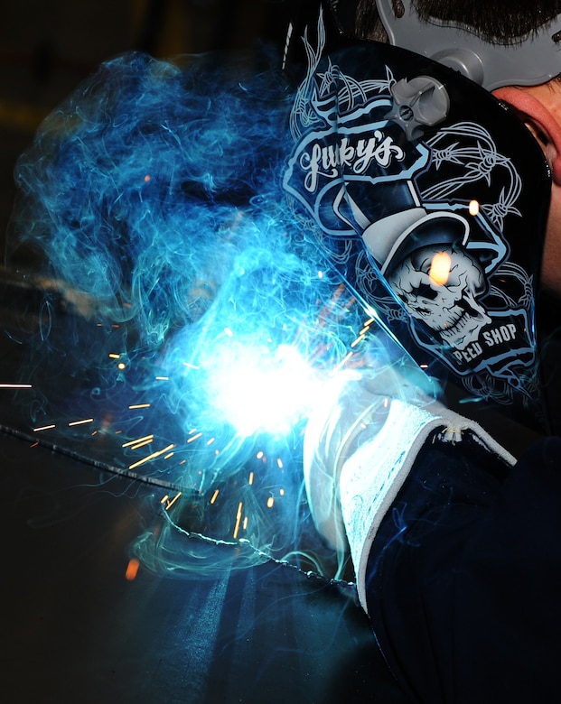 U.S. Air Force Staff Sgt. Raymond Russell, 1st Maintenance Squadron Metals Technology aircraft metals technologist, welds metal sheets together at Langley Air Force Base, Va., Feb. 19, 2013. Metals technology requires precision and attention to detail to accomplish the mission.  (U.S. Air Force photo by Senior Airman Teresa Aber/Released)