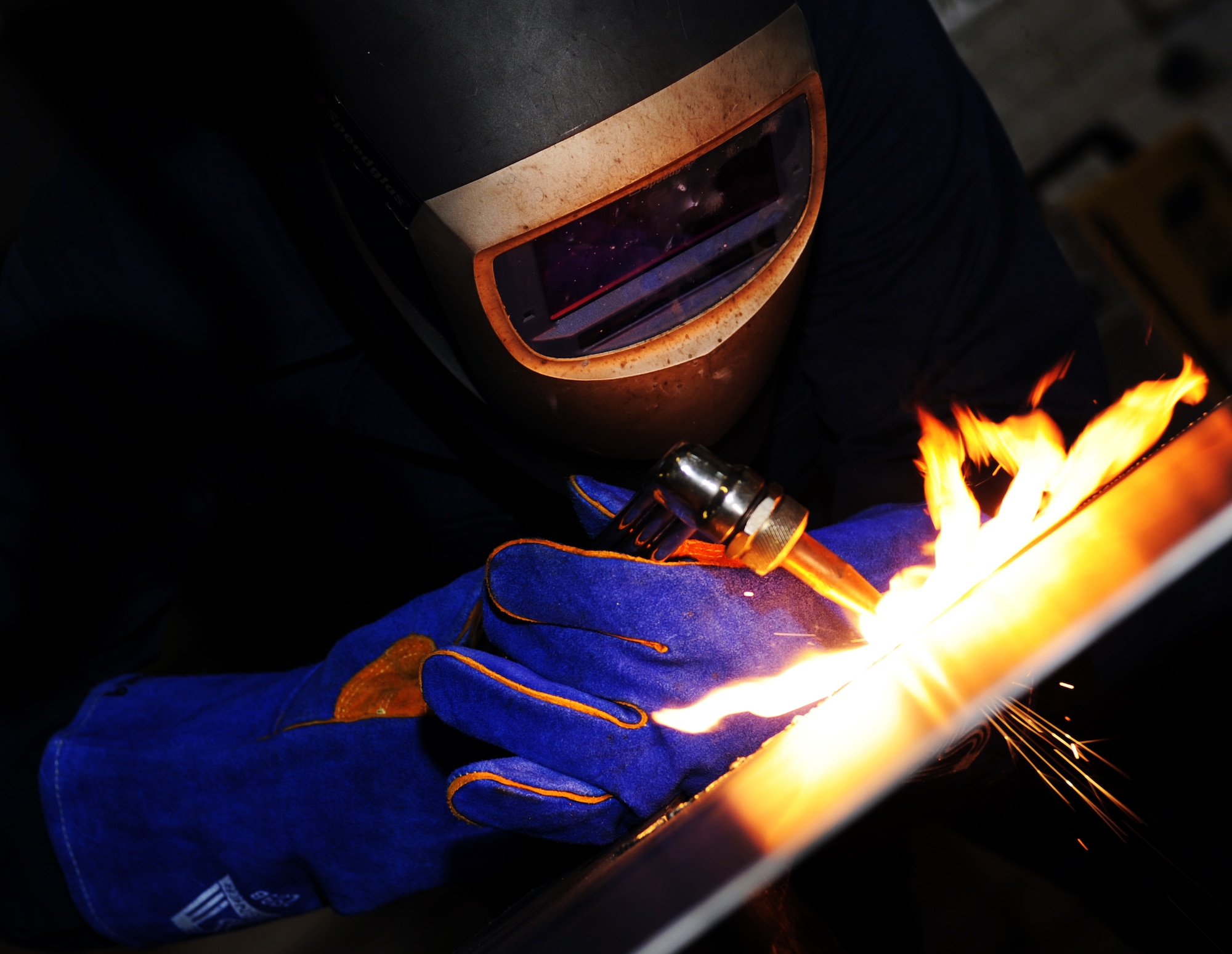 U.S. Air Force Staff Sgt. Raymond Russell, 1st Maintenance Squadron Metals Technology aircraft metals technologist, welds metal sheets together at Langley Air Force Base, Va., Feb. 19, 2013. Metals technology combines highly developed mechanical skills with a touch of artistic capabilities. (U.S. Air Force photo by Senior Airman Teresa Aber/Released)
