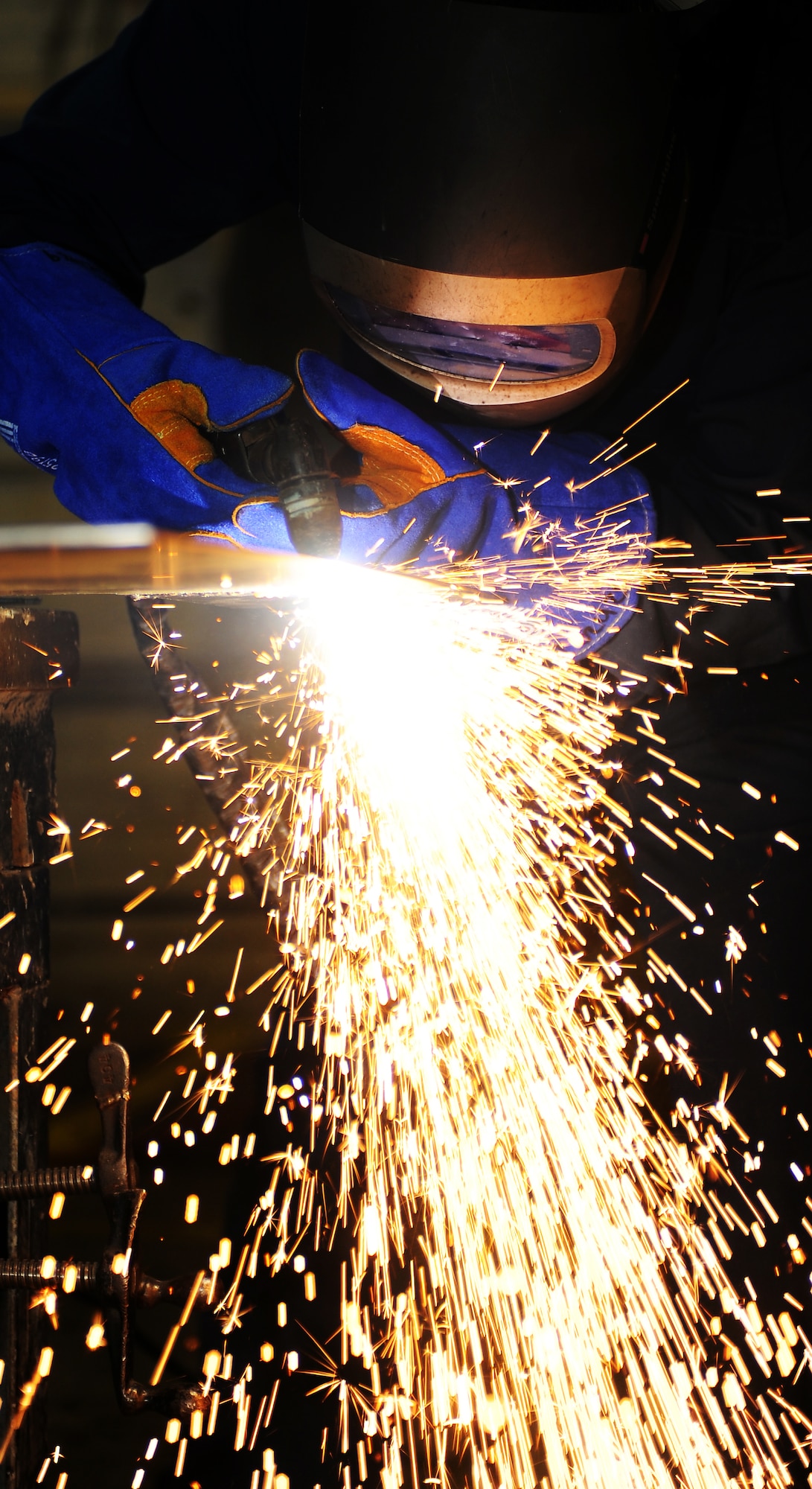 U.S. Air Force Staff Sgt. Raymond Russell, 1st Maintenance Squadron Metals Technology aircraft metals technologist, welds metal sheets together at Langley Air Force Base, Va., Feb. 19, 2013. Russell says there is always something new and something different to work on, giving the shop plenty of chances to get creative. (U.S. Air Force photo by Senior Airman Teresa Aber/Released)