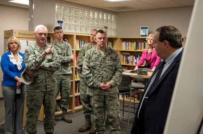 Chief Master Sgt. Richard Kaiser, Air Mobility Command command chief, asks Chris Gerry, 628th Force Support Squadron school liaison officer, a question about local schools during a briefing at the Airman and Family Readiness Center, Feb. 13, 2013, at Joint Base Charleston – Air Base, S.C. Kaiser and Gen. Paul Selva, Air Mobility Command commander, along with Selva’s wife Ricki, arrived at JB Charleston, Feb. 13, 2013, for a three-day visit of JB Charleston. (U.S. Air Force photo/Senior Airman Dennis Sloan)