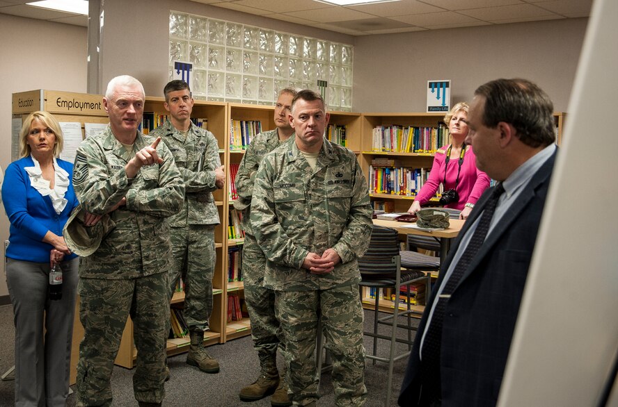 Chief Master Sgt. Richard Kaiser, Air Mobility Command command chief, asks Chris Gerry, 628th Force Support Squadron school liaison officer, a question about local schools during a briefing at the Airman and Family Readiness Center, Feb. 13, 2013, at Joint Base Charleston – Air Base, S.C. Kaiser and Gen. Paul Selva, Air Mobility Command commander, along with Selva’s wife Ricki, arrived at JB Charleston, Feb. 13, 2013, for a three-day visit of JB Charleston. (U.S. Air Force photo/Senior Airman Dennis Sloan)