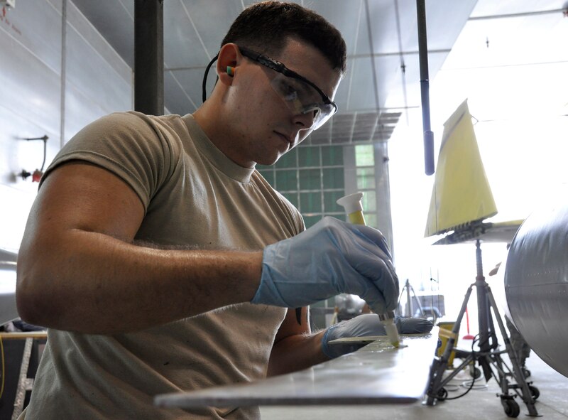 Airman 1st Class Rodney Maxfield, 482nd Maintenance Squadron structural maintenance, performs repairs on an F-4 Phantom II static display at Homestead Air Reserve Base, Fla., Feb. 25. The F-4, which is displayed on U.S. Route 1 in Homestead, Fla., will receive more than 2,000 hours of structural maintenance, repairs, and paint work at Homestead ARB. Homestead Air Force Base utilized the F-4 from 1981 to 1989. Once the repairs and painting are complete, the static display will be returned to its pedestal in Homestead. (U.S. Air Force photos/Ross Tweten) 