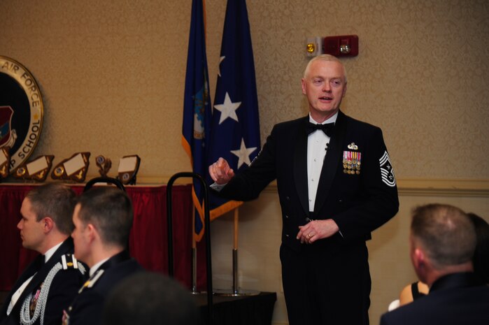 Chief Master Sgt. Richard Kaiser, Air Mobility Command command chief, speaks to Airmen Leadership School graduates and audience at the ALS graduation ceremony at the Charleston Club, Feb. 14, 2013, at Joint Base Charleston - Air Base, S.C. Kaiser and Gen. Paul Selva, AMC commander, were the guest speakers for the ceremony.