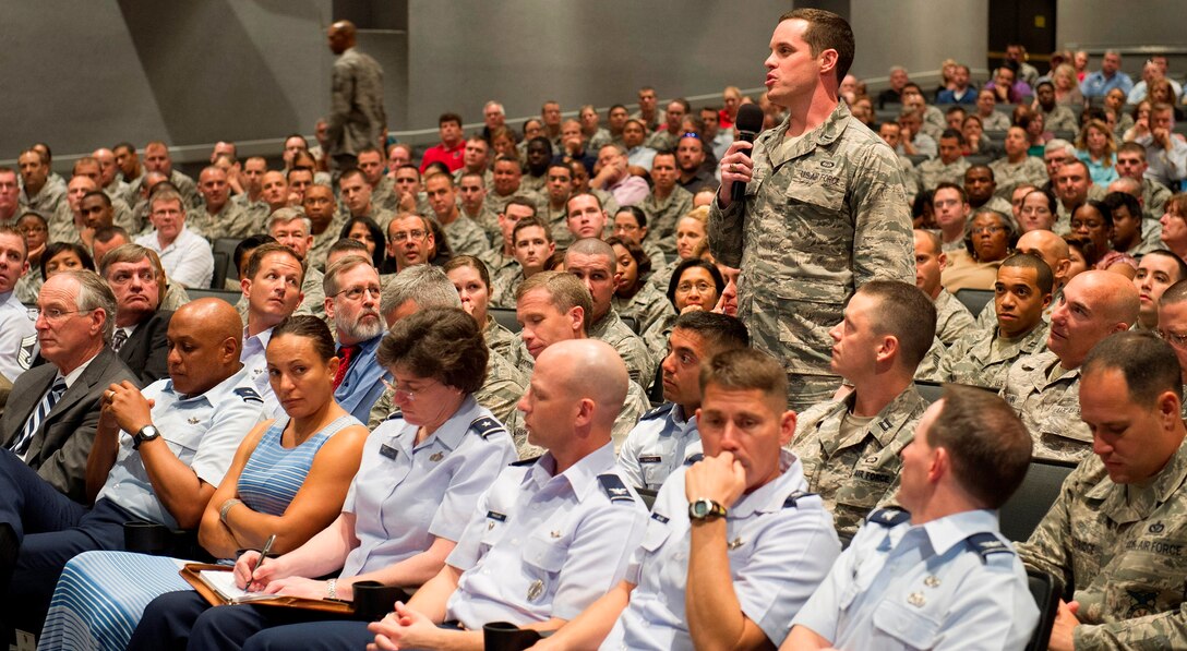 First Lt. Kurtis Schubeck from the  45th Weather Squadron, poses a question to Secretary of the Air Force Michael Donley during an “Airman’s call” at the base Feb. 21, 2013. During his remarks, Donley thanked military and civilian Airmen and their families for their continued service and support and discussed the potential impacts to sequestration. (U.S. Air Force Photo/Matthew Jurgens)