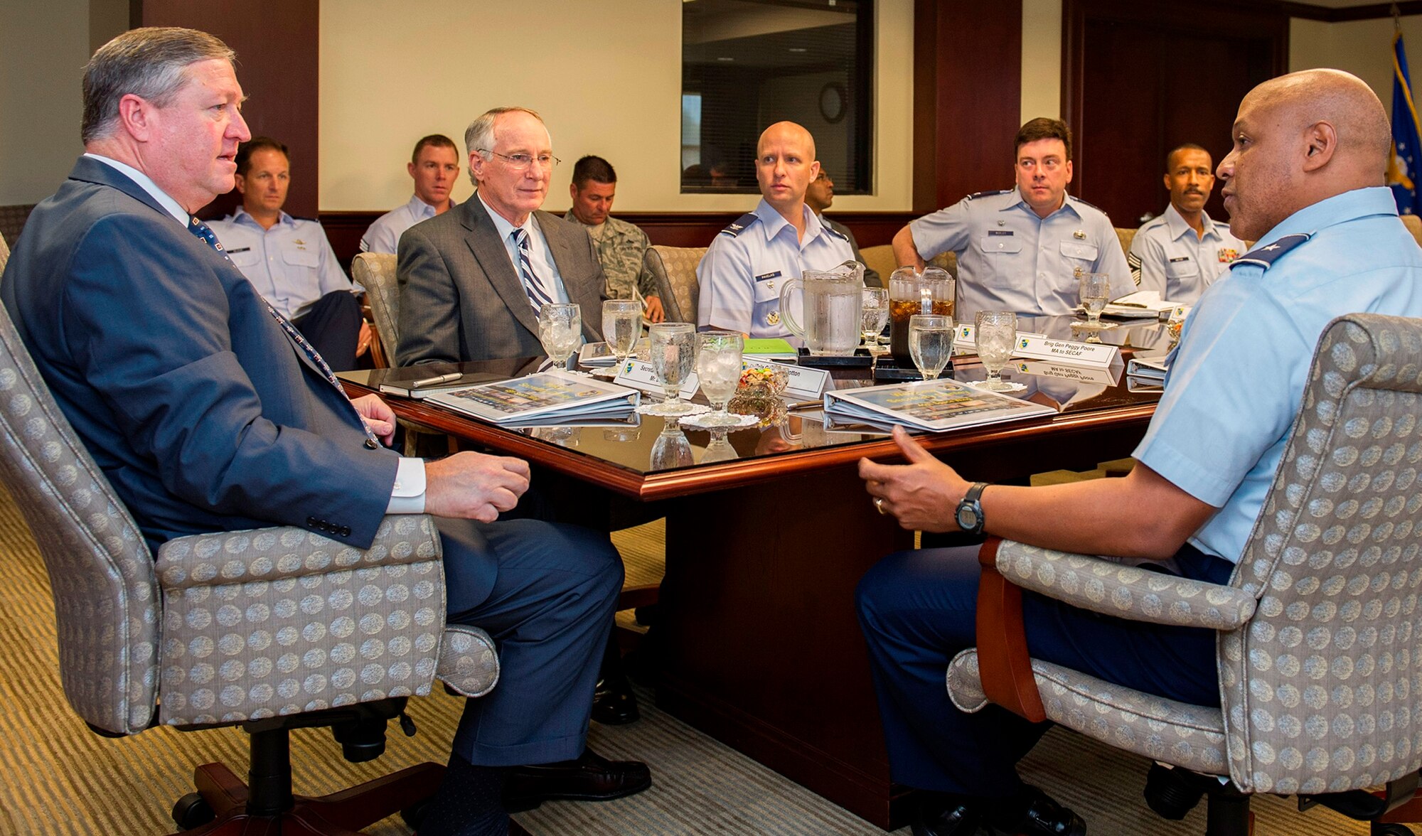Secretary of the Air Force Michael Donley (left) receives a briefing from Brig. Gen. Anthony Cotton, 45th Space Wing commander, (far right) during his tour of the wing Feb. 21. In addition to meeting with wing leadership, Donley had lunch with wing award winners, toured various locations around the base and held an “Airman’s call” to discuss the latest challenges affecting the service. (U.S. Air Force Photo/Matthew Jurgens)