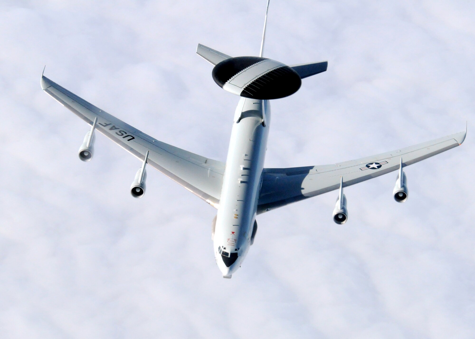 An E-3 Sentry from Tinker Air Force Base, Okla., continues its journey after taking on fuel from a 100th Air Refueling Wing KC-135 Stratotanker from RAF Mildenhall, England, Feb. 22, 2013, over Scotland. The E-3 airborne warning and control system is capable of providing data analysis and real-time information of battle spaces to U.S. military commanders anywhere in the world. (U.S. Air Force photo by 1st Lt. Christopher Mesnard/Released)