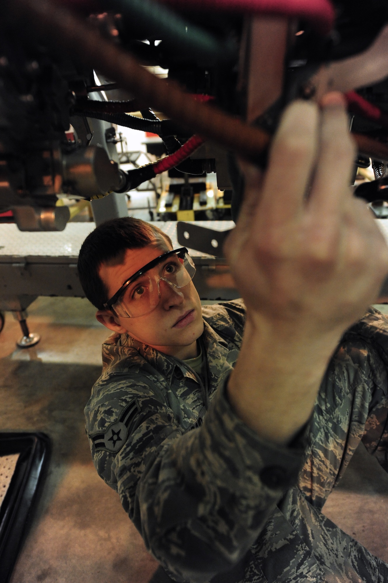 WHITEMAN AIR FORCE BASE, Mo. -- Airman 1st Class John Kincaid, 509th Maintenance Squadron aerospace propulsion apprentice, installs a cannon plug on a B-2 Spirit engine Feb. 13. The cannon plug is used by maintainers as a disconnect point for electrical cables. (U.S. Air Force photo/Staff Sgt. Nick Wilson) (Released)