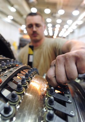 WHITEMAN AIR FORCE BASE, Mo. -- Senior Airman Brady Dell, 509th Maintenance Squadron aerospace propulsion journeyman, checks the actuator of a B-2 Spirit engine for tightness, Feb. 13.  One loose bolt could destroy the multi-million dollar engine during flight and possibly cause a B-2 to crash. (U.S. Air Force photo/Staff Sgt. Nick Wilson) (Released)