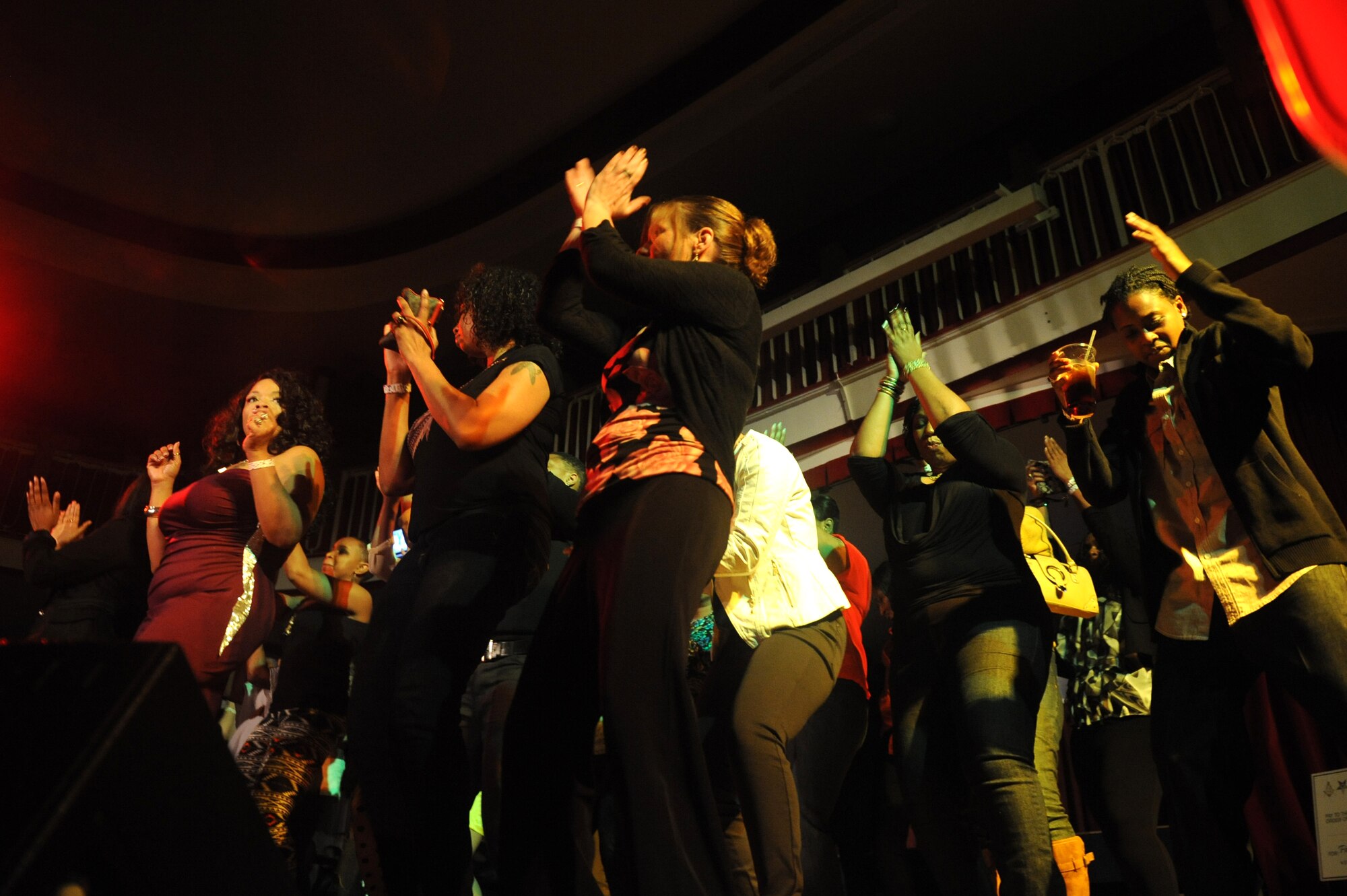 Audience members dance on stage through intermission during Apollo Night at the Armstrong Club on Vogelweh Military Complex, Germany, Feb. 23, 2013. Apollo Night in the Kaiserslautern Military Community traces its roots to the original event in Harlem New York, and gives members of the KMC a chance to do something out of the ordinary.  (U.S. Air Force photo/Senior Airman Aaron-Forrest Wainwright)