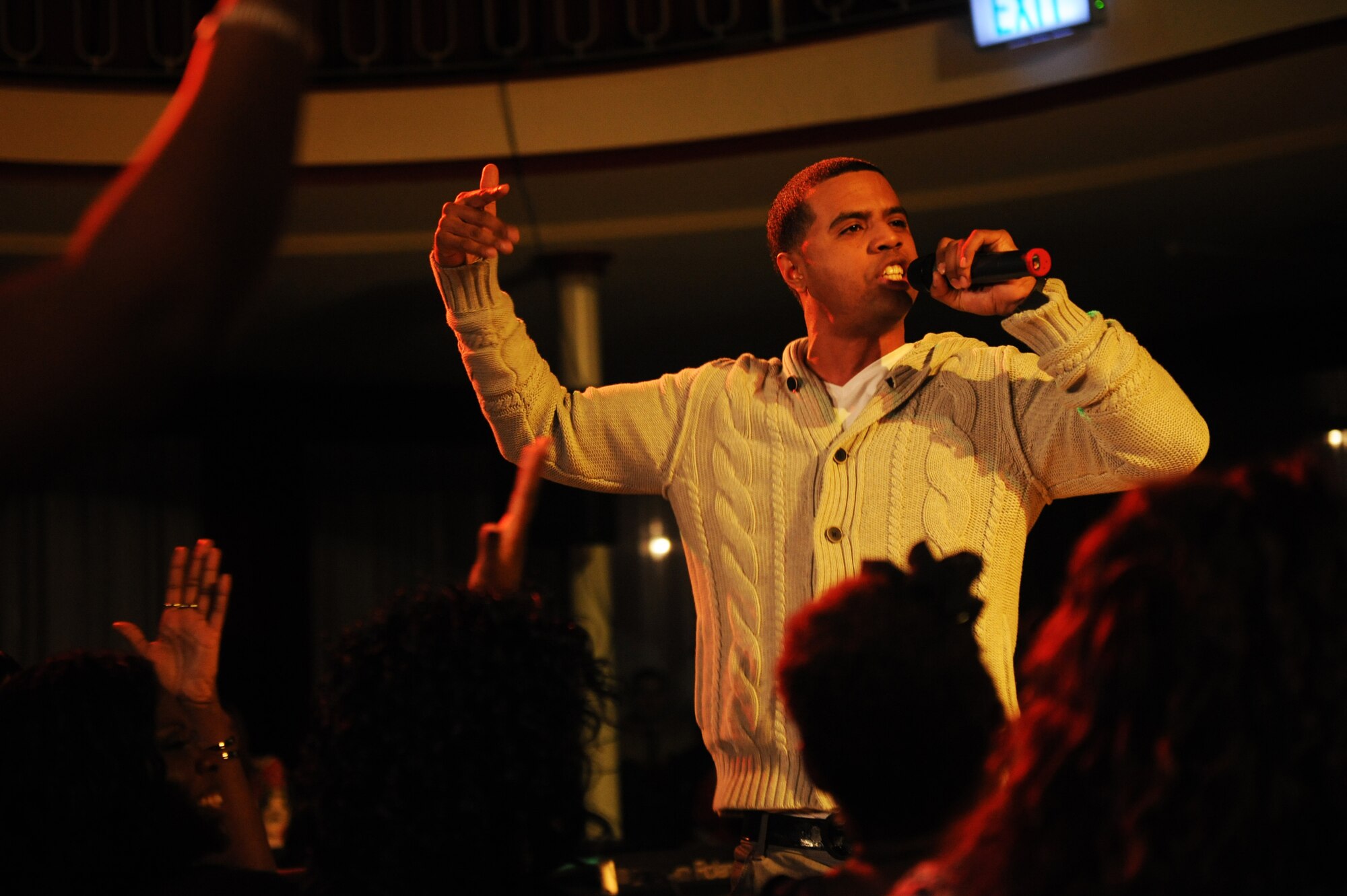 “Base Pay” raps during Apollo Night at the Armstrong Club on Vogelweh Military Complex, Germany, Feb. 23, 2013. Apollo Night in the Kaiserslautern Military Community traces its roots to the original event in Harlem New York, and gives members of the KMC a chance to do something out of the ordinary.  (U.S. Air Force photo/Senior Airman Aaron-Forrest Wainwright)
