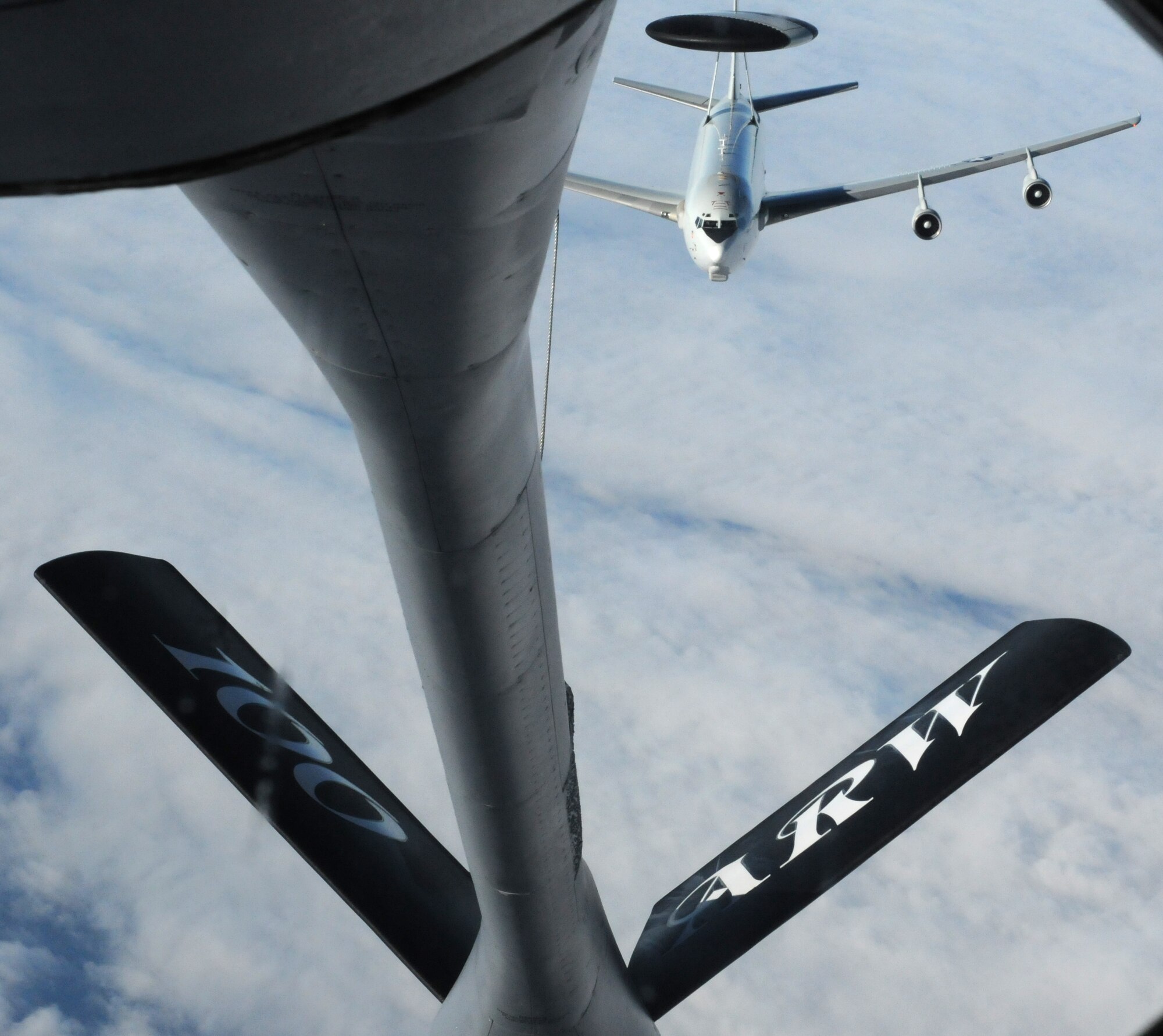 An E-3 Sentry from Tinker Air Force Base, Okla., makes its final approach to take on fuel from a KC-135 Stratotanker from the 100th Air Refueling Wing at RAF Mildenhall, England, Feb. 22, 2013, over Scotland during a refueling mission. The 100th ARW provides refueling missions to U.S. Air Force aircraft like the E-3 as they cross the Atlantic Ocean, extending the reach and capability of the U.S. Air Force’s fleet. (U.S. Air Force photo by 1st Lt. Christopher Mesnard/Released)