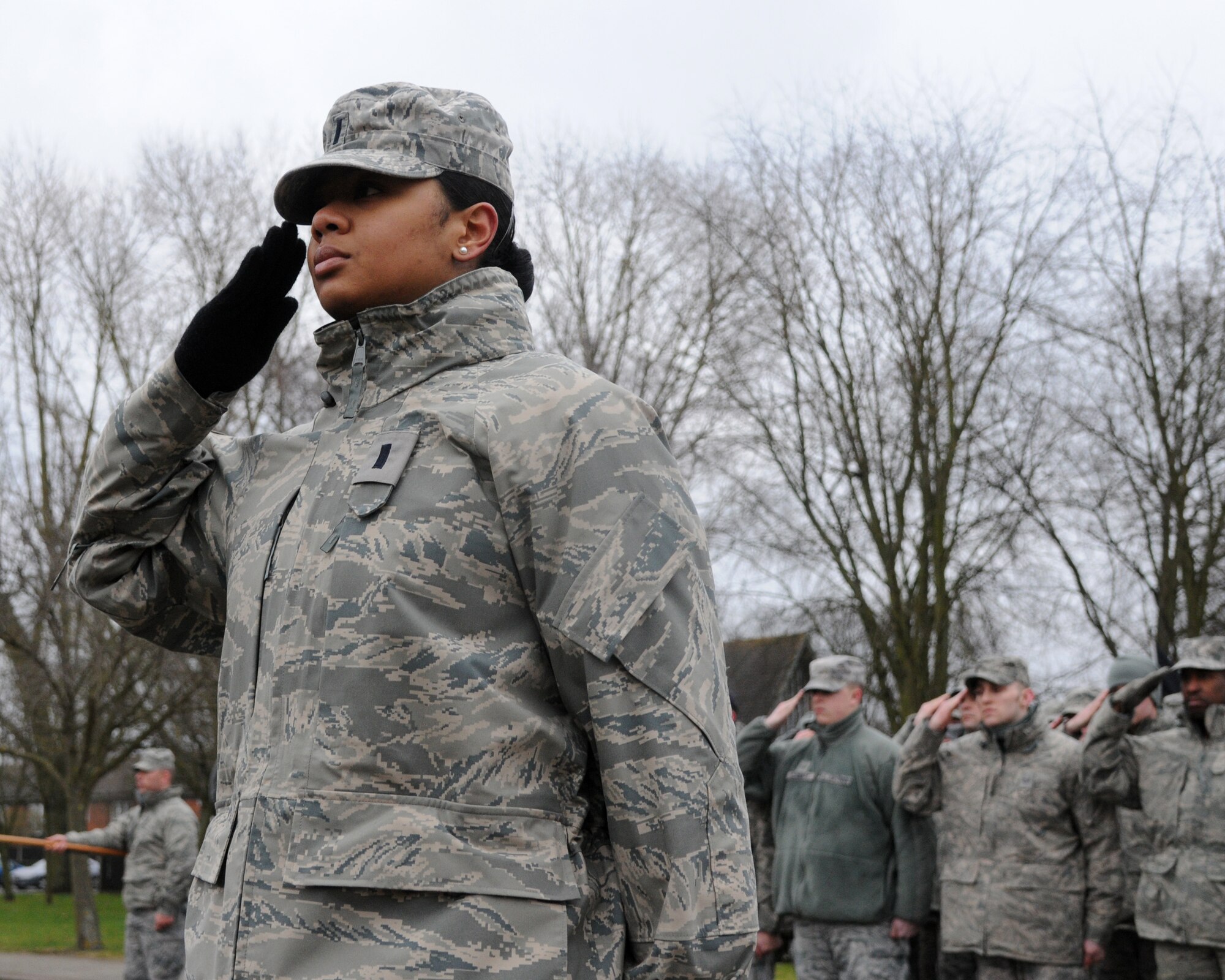 1st Lt. Loren Hulen, 100th Force Support Squadron Officer in charge of readiness and plans, salutes during a retreat ceremony Feb. 22, 2013, at RAF Mildenhall, England. Hulen, a native of Germantown, Md., led a flight of Airmen from the 100th Mission Support Group during the February retreat ceremony. The daughter of a chief master sergeant, Hulen received her commission May13, 2009, through Reserve Officers' Training Corps. at Howard University, Washington D.C.  She previously served as the 100th FSS Career Development Section chief and the Sustainment Services Deputy flight commander.  Hulen has been at RAF Mildenhall since September 2009; her next assignment is to be the sexual assault response coordinator for the 2nd Bomb Wing at Barksdale Air Force Base, La. (U.S. Air Force photo by Airman 1st Class Kelsey Waters/Released)