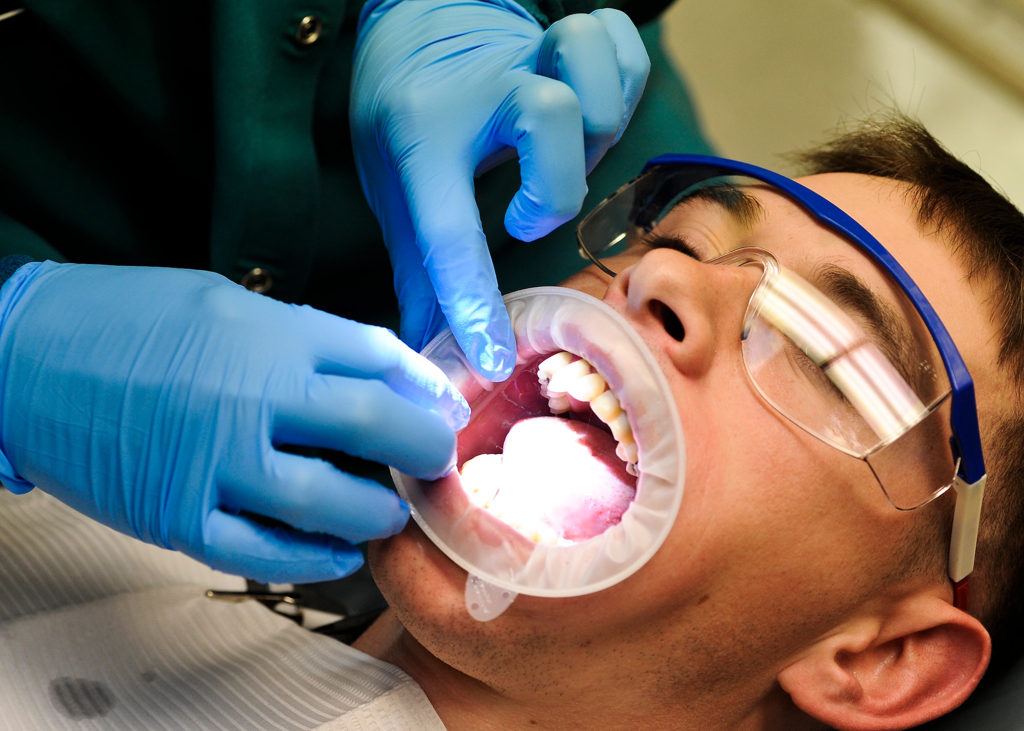 A patient at 1st Special Operations Dental Squadron on Hurlburt Field, Fla., gets prepared to get cavities repaired in his mouth Feb, 20, 2013. The 1st SODS earned the Air Force Special Operations Command Medium-Sized Dental Clinic of the Year in 2012. (U.S. Air Force photo/Airman 1st Class Christopher Callaway)
