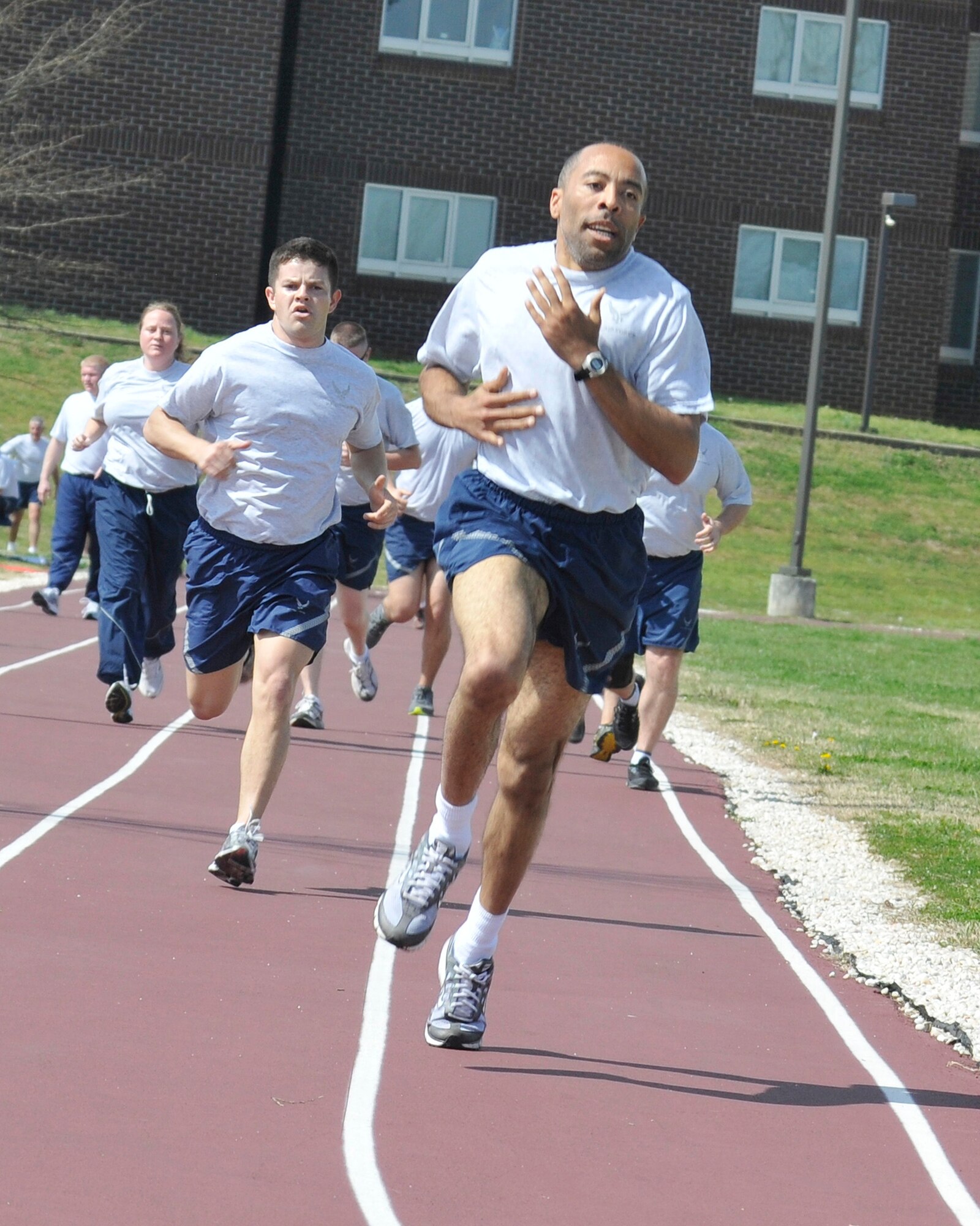 Airmen attending the The Paul H. Lankford Enlisted Professional Military Education Center's NCO Academy and Airman Leadership School at The I.G. Brown Training and Education Center perform physical training on the campus track, Mar. 15, 2012.  (National Guard photo by Master Sgt. Kurt Skoglund/Released)