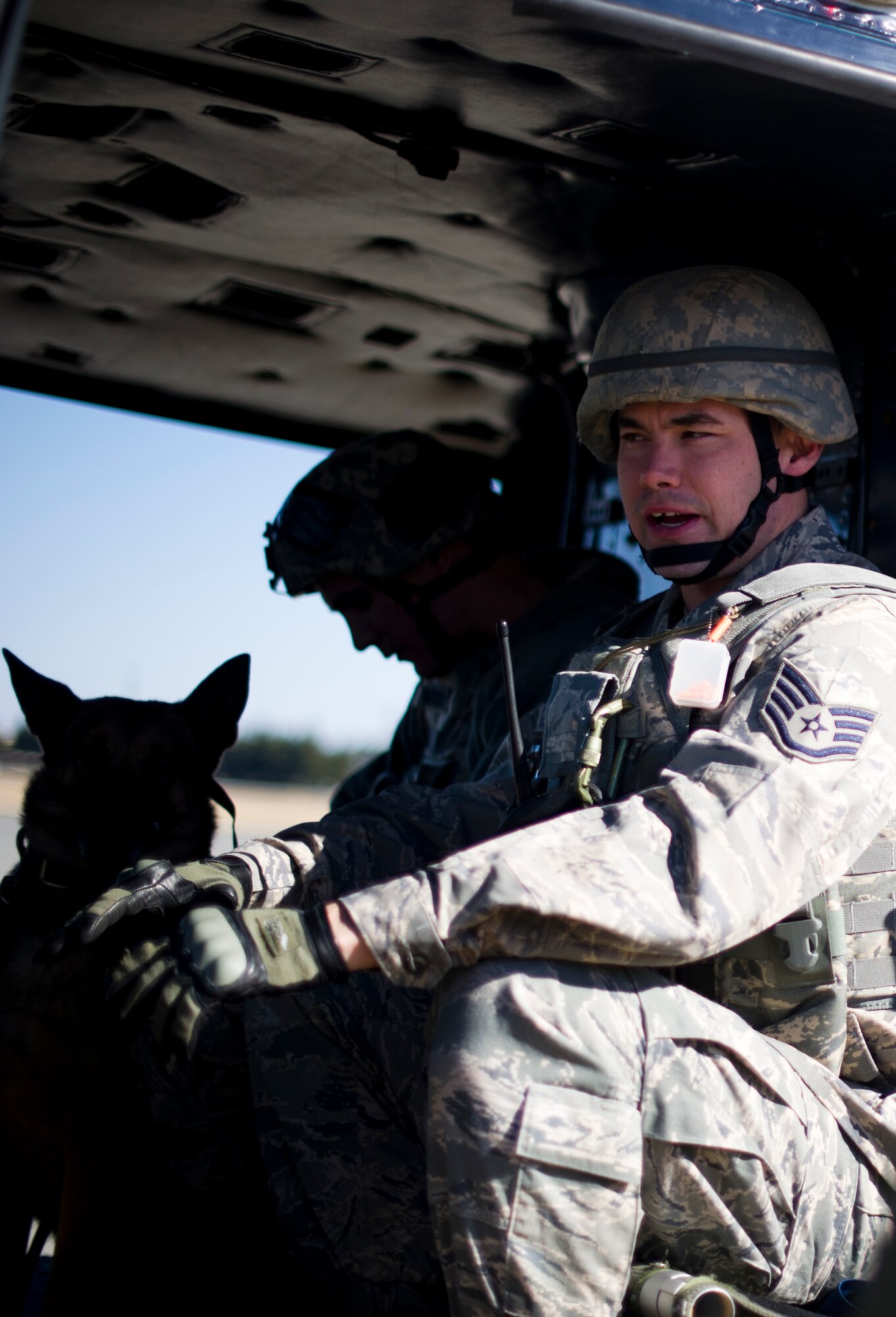 YOKOTA AIR BASE, Japan -- Staff Sgt. David Duritsky, a military working dog handler with 374th Security Force Squadron, sits in a UH-1N Huey helicopter before fly-away security team training at Yokota Air Base, Japan, Feb. 25, 2013. During contingencies, FAST members, embed with the aircrew and travel with Yokota aircraft providing protection in potentially dangerous areas. (U.S. Air Force photo by Staff Sgt. Stacy Moless)