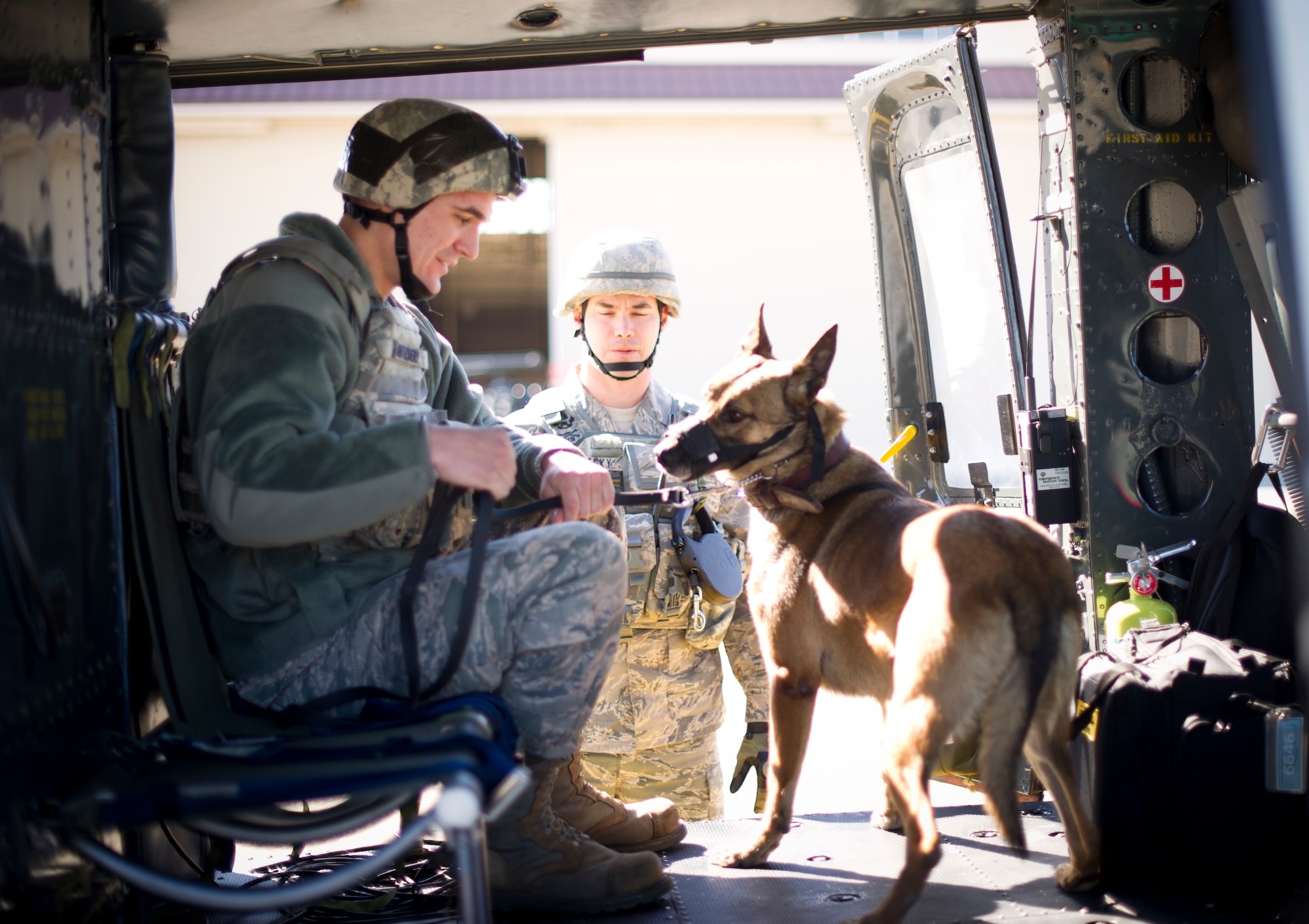 YOKOTA AIR BASE, Japan -- Senior Airman Andrew Montgomery, 374th Security Forces Squadron military working dog handler, boards a UH-1N Huey helicopter to begin fly-away security team training at Yokota Air Base, Japan, Feb. 25, 2013. During contingencies, FAST members, fly as members of an aircrew, traveling into potentially dangerous areas protecting all crew members and the aircraft. (U.S. Air Force photo by Staff Sgt. Stacy Moless)