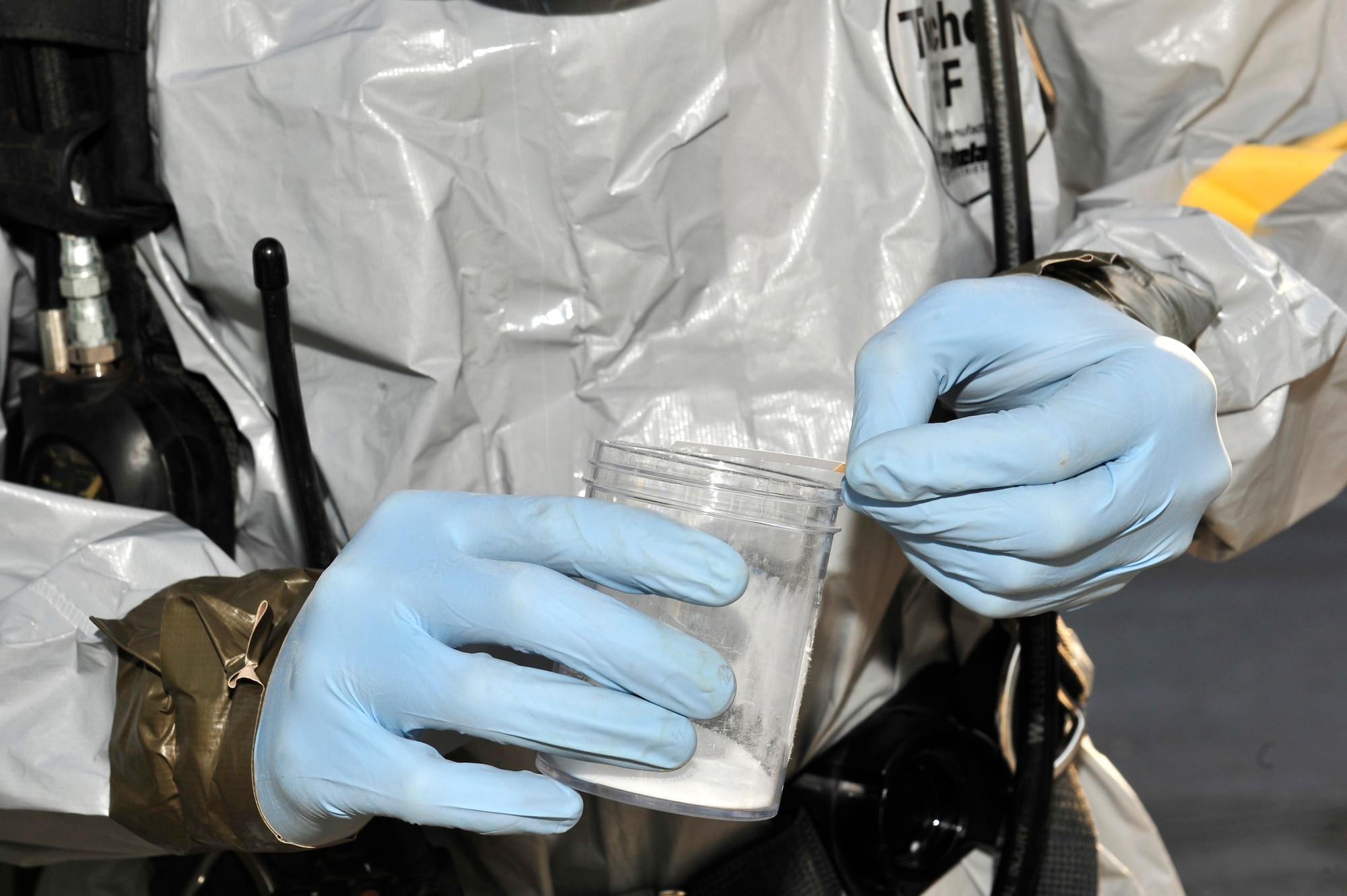 U.S. Air Force Staff Sgt. Jordon Stipcak, 380th Expeditionary Civil Engineer Squadron emergency management craftsman, tests suspicious materials during a chemical, biological, radiological, nuclear and explosives (CBRNE) response exercise at an undisclosed location in Southwest Asia Feb. 15, 2013. The emergency management office participates in monthly exercises to ensure they are ready in the case of a real-world scenario. Stipcak is deployed from Kadena Air Base, Japan. (U.S. Air Force photo by Tech. Sgt. Christina M. Styer/Released)