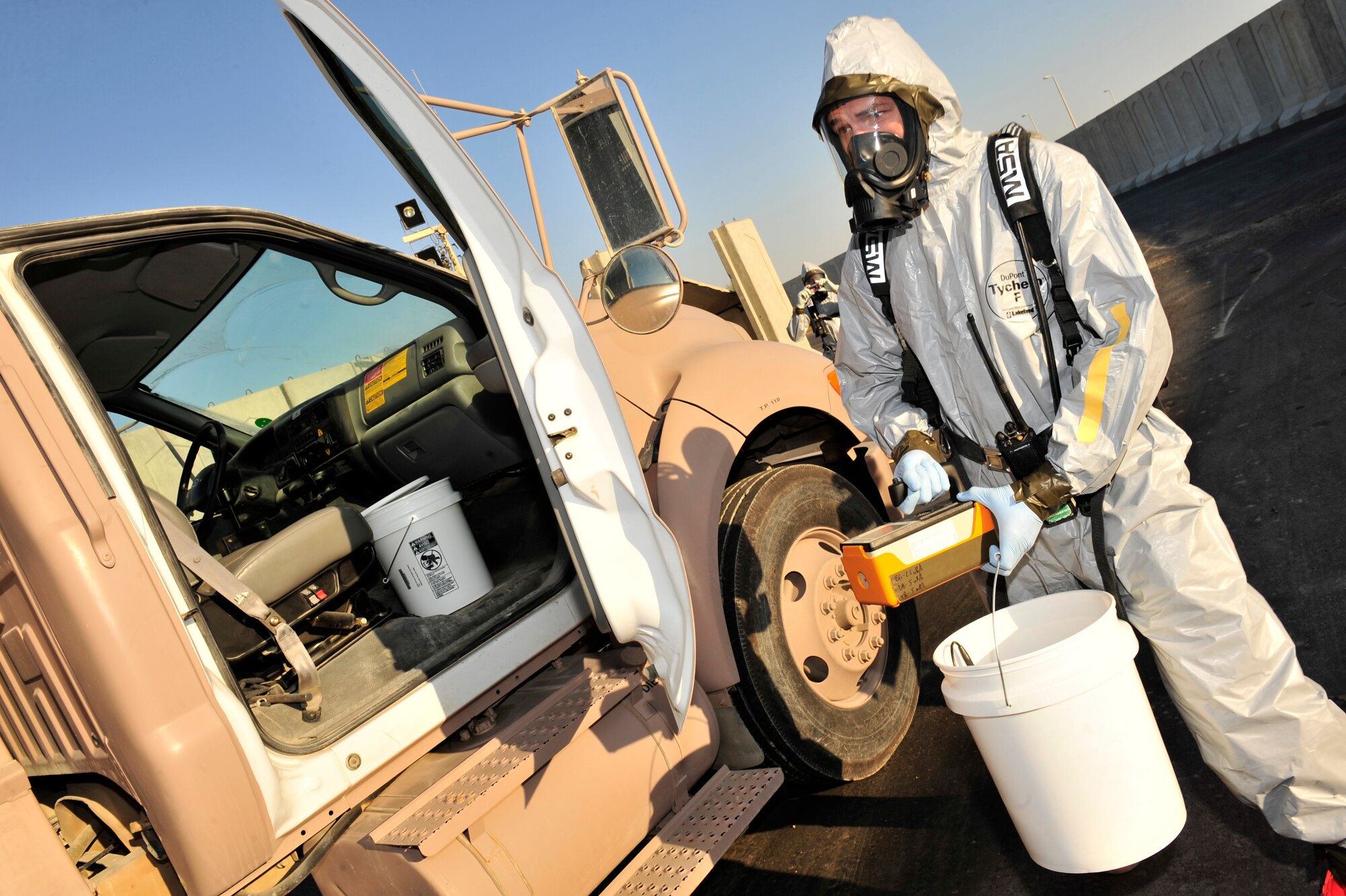 U.S. Air Force Staff Sgt. Jordon Stipcak, 380th Expeditionary Civil Engineer Squadron emergency management craftsman, uses a radioactive isotope identifier to test the air around a truck carrying suspicious materials during a chemical, biological, radiological, nuclear and explosives (CBRNE) response exercise at an undisclosed location in Southwest Asia Feb. 15, 2013. The emergency management office participates in monthly exercises to ensure they are ready in the case of a real-world scenario. Stipcak is deployed from Kadena Air Base, Japan. (U.S. Air Force photo by Tech. Sgt. Christina M. Styer/Released)