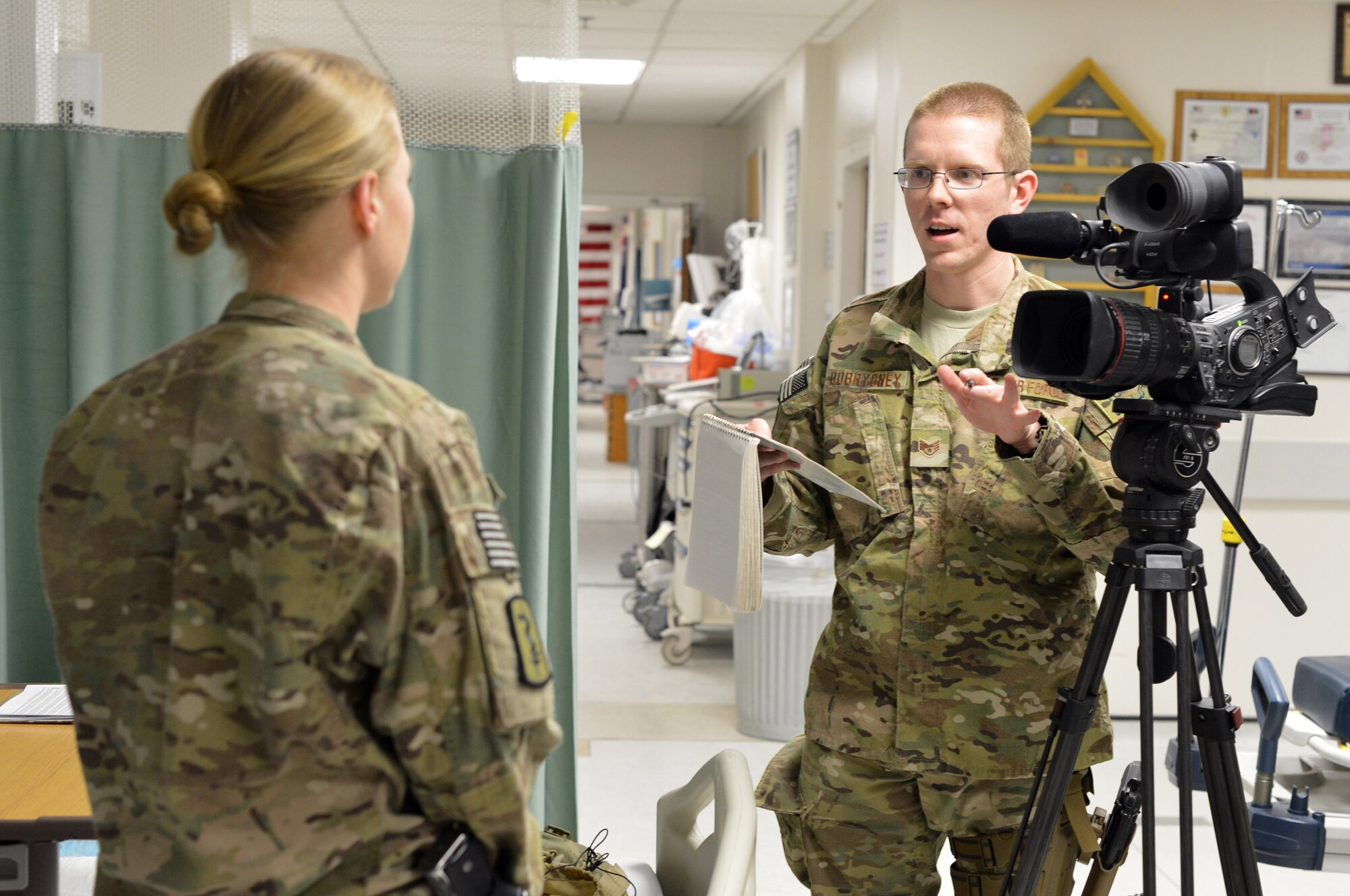 Staff Sgt. David Dobrydney, 455th Air Expeditionary Wing Public Affairs staff writer, conducts an interview at the Craig Joint Theater Hospital on Bagram Airfield, Afghanistan, Feb. 19, 2013. In addition to providing articles for the base website, Dobrydney created the 455th AEW?s official newsletter. (U.S. Air Force photo/Master Sgt. Jun Kim