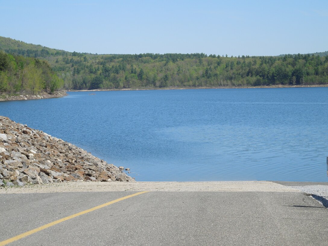 The boat ramp at Colebrook Dam, Riverton, Conn., which is located on the Farmington River, and is a part of a network of flood control dams on tributaries of the Connecticut River. Completed in 1969 at a cost of $14.3 million, the amount of water stored at Colebrook River Lake can fluctuate substantially. The pool, used for both water supply and fishery habitat, normally covers an area of about 750 acres. Colebrook River Lake can store up to 16.56 billion gallons of water for flood risk management purposes.