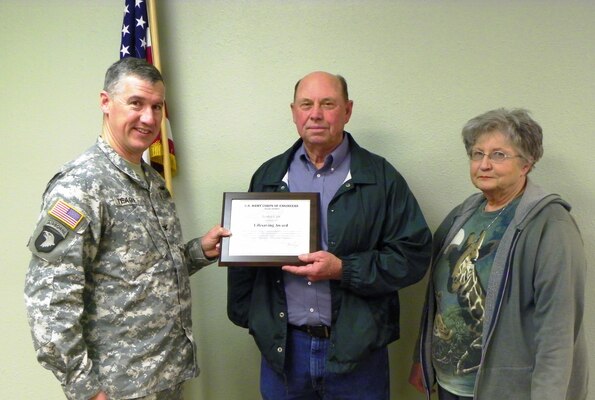 Col. Michael Teague presents a lifesaving award to Lester Cox. Cox saved a man from drowning in May 2012 at Waurika Lake. 