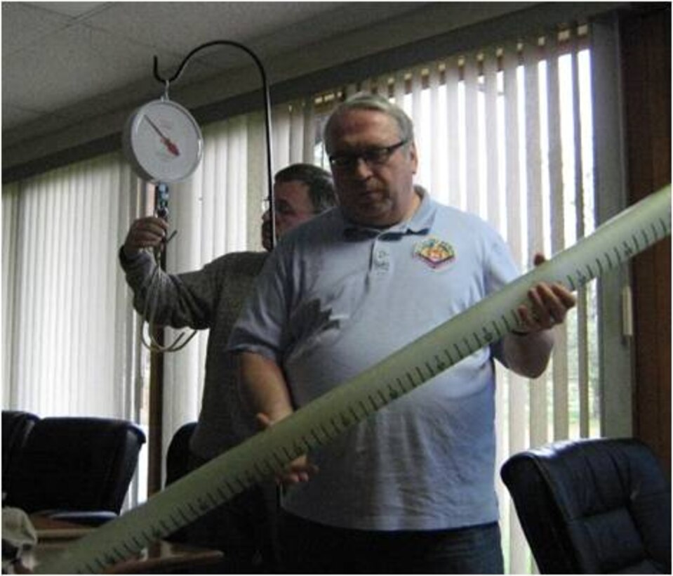 Pittsburgh Water Management Chief Werner Loehlein holds a snow sampling tube.