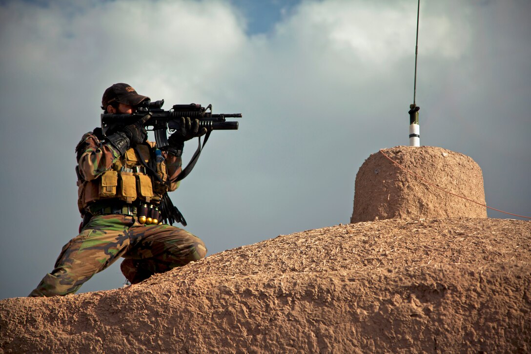 An Afghan national army special forces soldier maintains security from a temporary patrol base in Herat province, Afghanistan, Feb. 17, 2013. Coalition force members and Afghan special forces teams conducted satellite patrols from a temporary patrol base to lure insurgents out of hiding.
