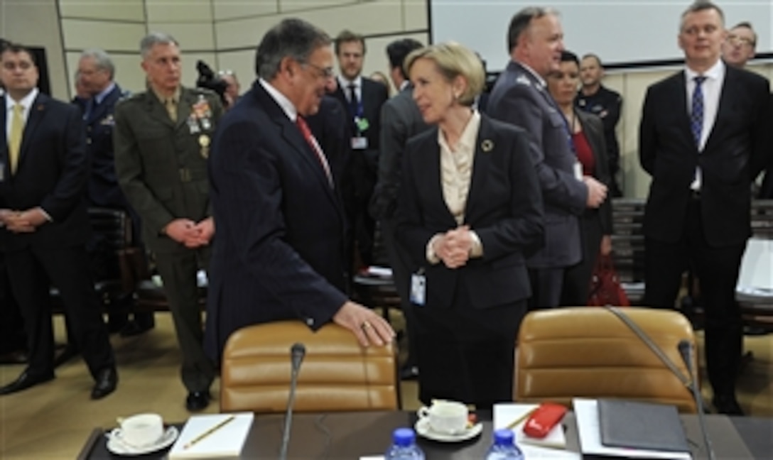 Secretary of Defense Leon E. Panetta, left, listens to Norwegian Minister of Defense Anne-Grete Strøm-Erichsen, right, as the two leaders attend meetings at the NATO Defense Ministerial meetings in Brussels, Belgium, on Feb. 21, 2013.  The current International Security Assistance Force mission and the follow-on NATO mission in Afghanistan are the central topic of group meetings and Panetta’s own one-on-one discussions with allied and partner ministers here this week.  