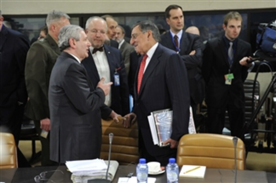 Secretary of Defense Leon E. Panetta, right, listens to Italy's Minister of Defense Giampaolo Di Paola, left, as the two leaders attend meetings at the NATO Defense Ministerial meetings in Brussels, Belgium, on Feb. 21, 2013.  The current International Security Assistance Force mission and the follow-on NATO mission in Afghanistan are the central topic of group meetings and Panetta’s own one-on-one discussions with allied and partner ministers here this week.  