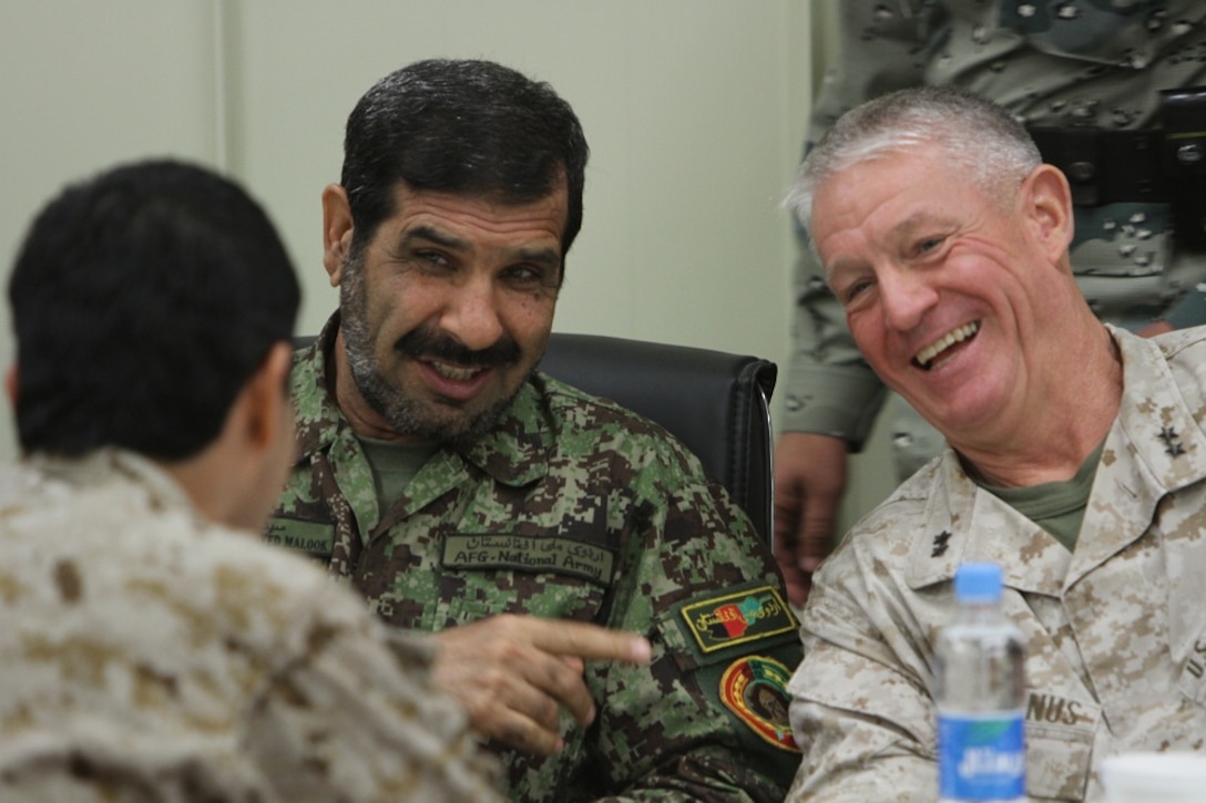 Major Gen. Charles M. Gurganus, the I Marine Expeditionary Force (Forward) and Regional Command Southwest commanding general, speaks to distinguished coalition and Afghan officials during the I MEF (Fwd) farewell dinner at the Afghan Cultural Center here, Feb. 25. Major Gen. Gurganus, in his farewell speech, said as the coalition continues to advise Afghan National Security Forces, "guns and bullets" will become less important and education and economic development will be the key to Afghanistan's future. (Official U.S. Marine Corps photo by Sgt. Bryan A. Peterson)