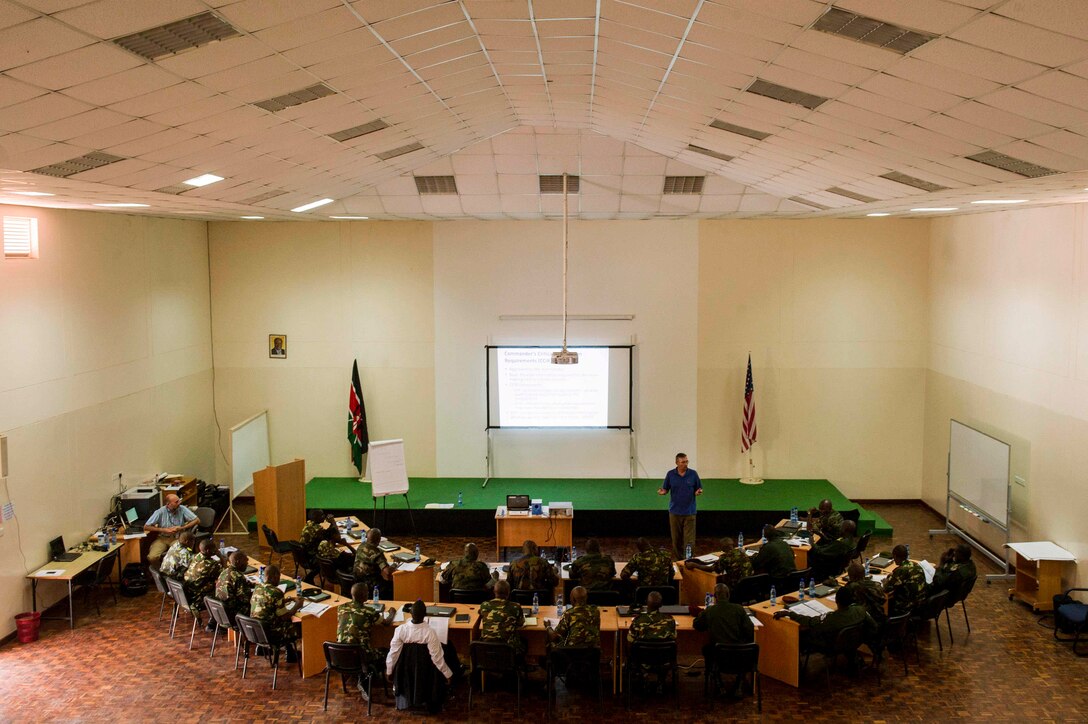 Randy Bretzin, Intelligence Training instructor, U.S. Africa Command, teaches critical thinking skills to East African service members at the Military Intelligence Basic Officer Course-Africa (MIBOC-A) in Nairobi, Kenya, Jan. 24, 2013. Military officers from Kenya, Uganda, Burundi, Ethiopia, Tanzania, and South Sudan are participating in the eight-week course. MIBOC-A provides partner nation junior offices with the skills to work as part of a military intelligence staff. Marine Corps Forces Africa is conducting the training in support of Combined Joint Task Force-Horn of Africa.