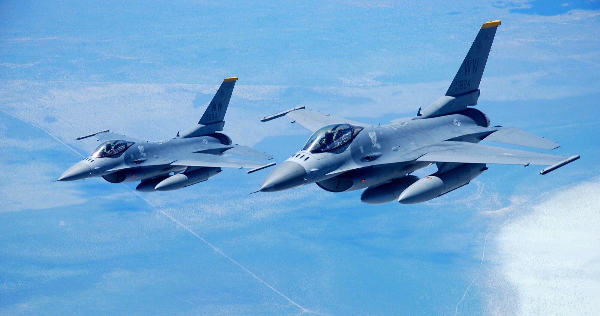 Two F-16 Fighting Falcons, representing the Misawa Air Base, Japan, demonstration team, head for Australia to take part in the Australian International Airshow 2013 Feb. 22, 2013. The U.S. military will be represented at the AIA13 at Avalon Airport, Victoria, Australia, from Feb. 26 through March 3, to demonstrate its dedication to ensuring stability and security of the Asia-Pacific region. A cross-section of U.S. military aircraft and equipment are scheduled to be present through static displays and aerial demonstrations, including the United States Air Force’s F-22 Raptor, C-17 Globemaster III, F-16 Fighting Falcon, B-52 Stratofortress, and KC-135 Stratotanker. Approximately 220 U.S. service members are supporting AIA13, which represents a unique opportunity for the United States to showcase its aviation prowess and promote strong military-to-military ties with its Pacific allies and friends. (U.S. Air Force photo/Capt. Natassia Cherne)