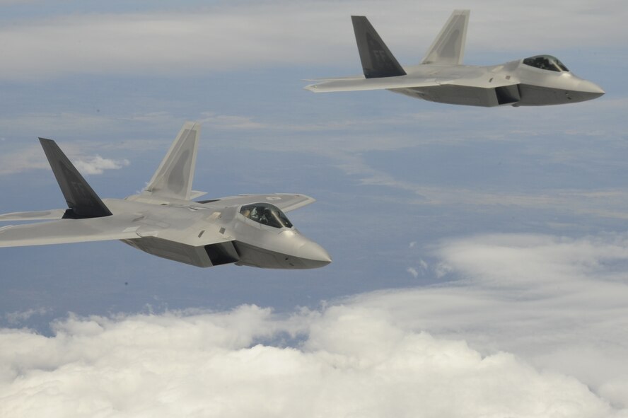 F-22 Raptors, representing Langely Air Force Base, Viginia, demonstration team, tears through Australian skies as they make their way to Avalon Airport for the Feb. 26 to March 3, Australian International Airshow 2013 on Feb. 22, 2013. The AIA13, one of the largest, biennial international trade shows in the Pacific, is expected to draw over 350,000 visitors and features approximately 500 defense exhibitors from 35 countries. A cross-section of U.S. military aircraft and equipment are scheduled to be present through static displays and aerial demonstrations. Displayed aircraft include: United States Air Force F-22 Raptor, C-17 Globemaster III, F-16 Fighting Falcon, B-52 Stratofortress, and KC-135 Stratotanker. (U.S. Air Force photo by Airman 1st Class Kenna Jackson)